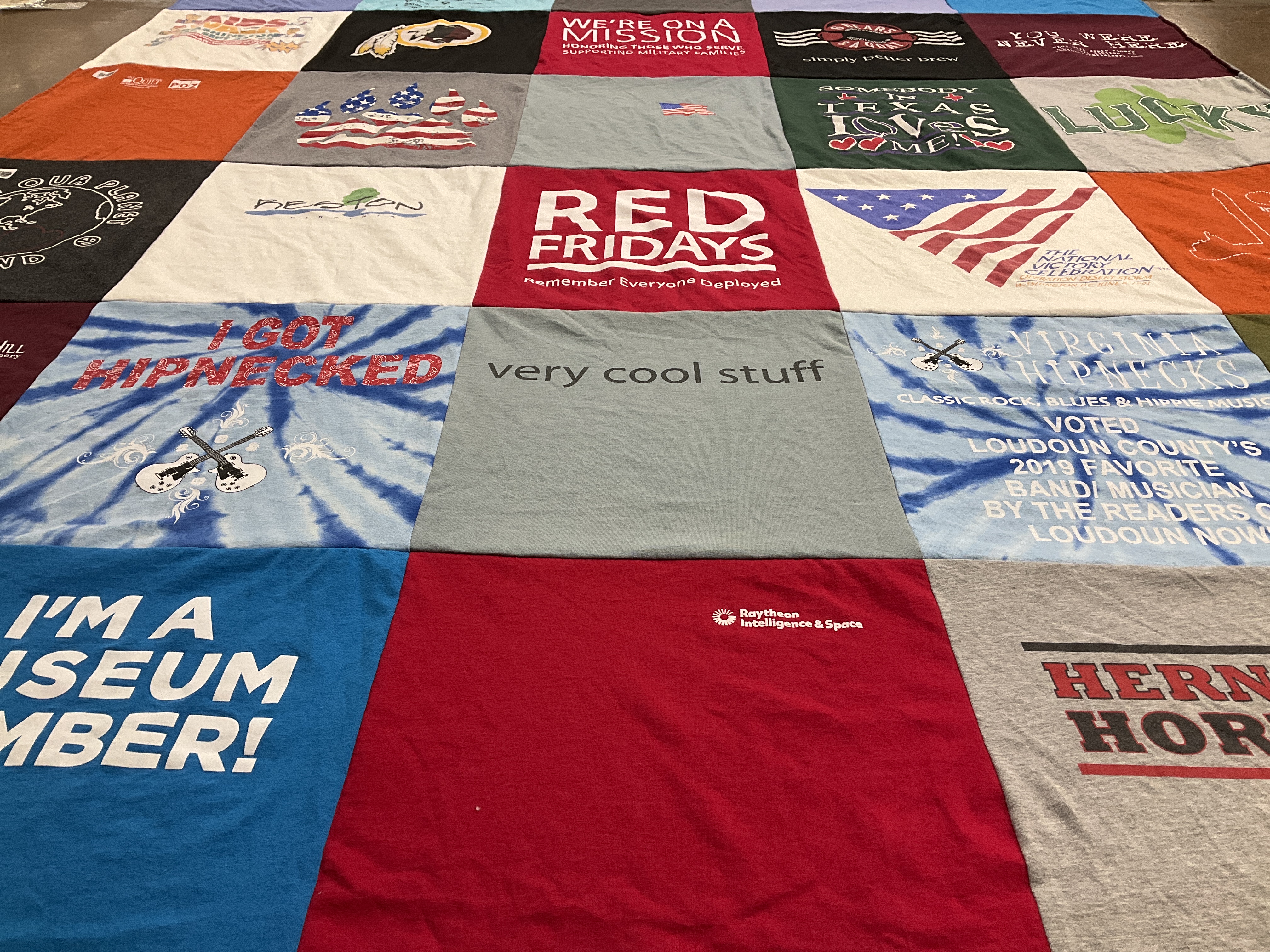 Custom Project Repat t-shirt quilt featuring shirts from herndon high school.