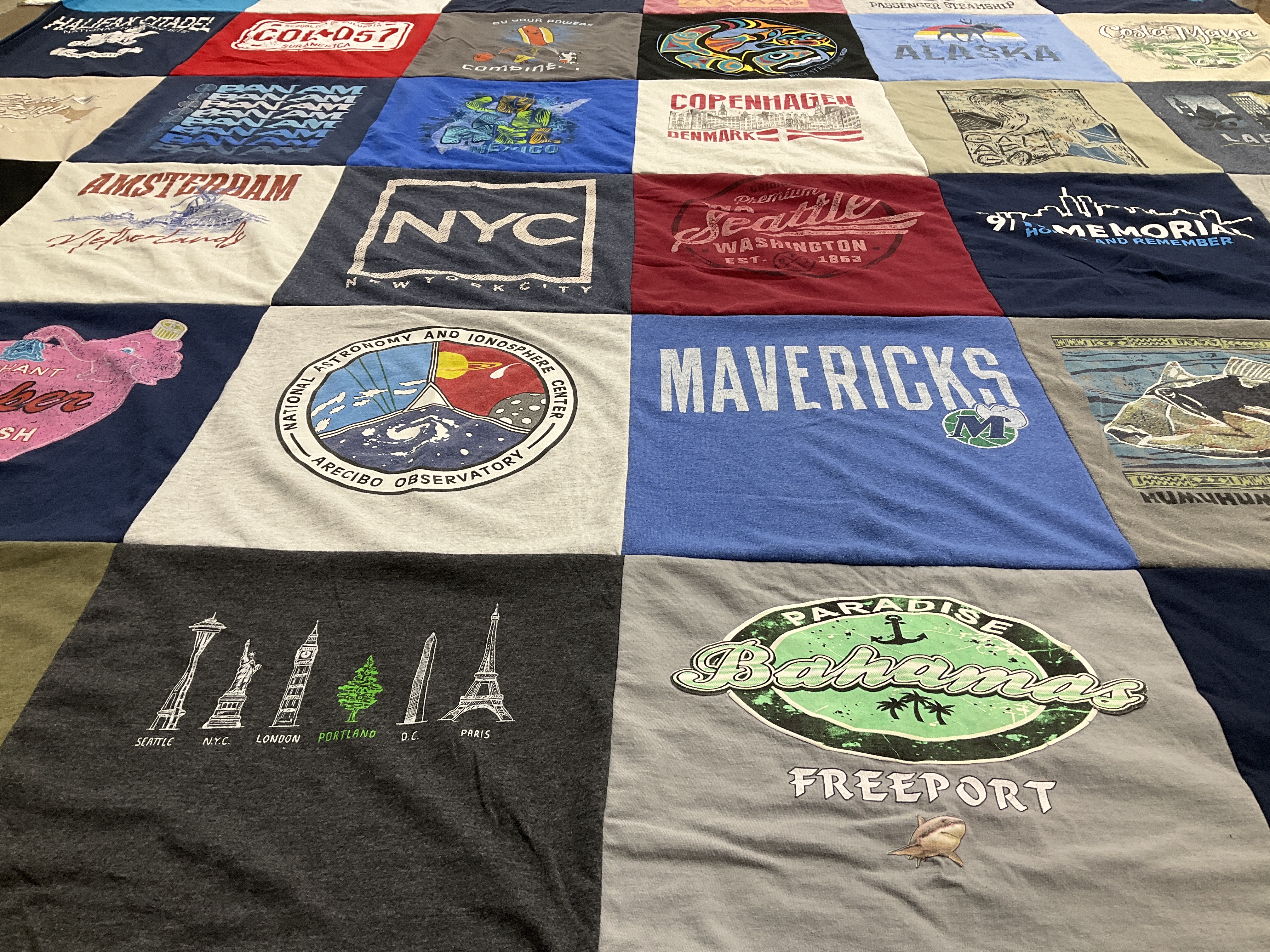T-shirt quilt with travel, astrophysics themes by Cliff from TX