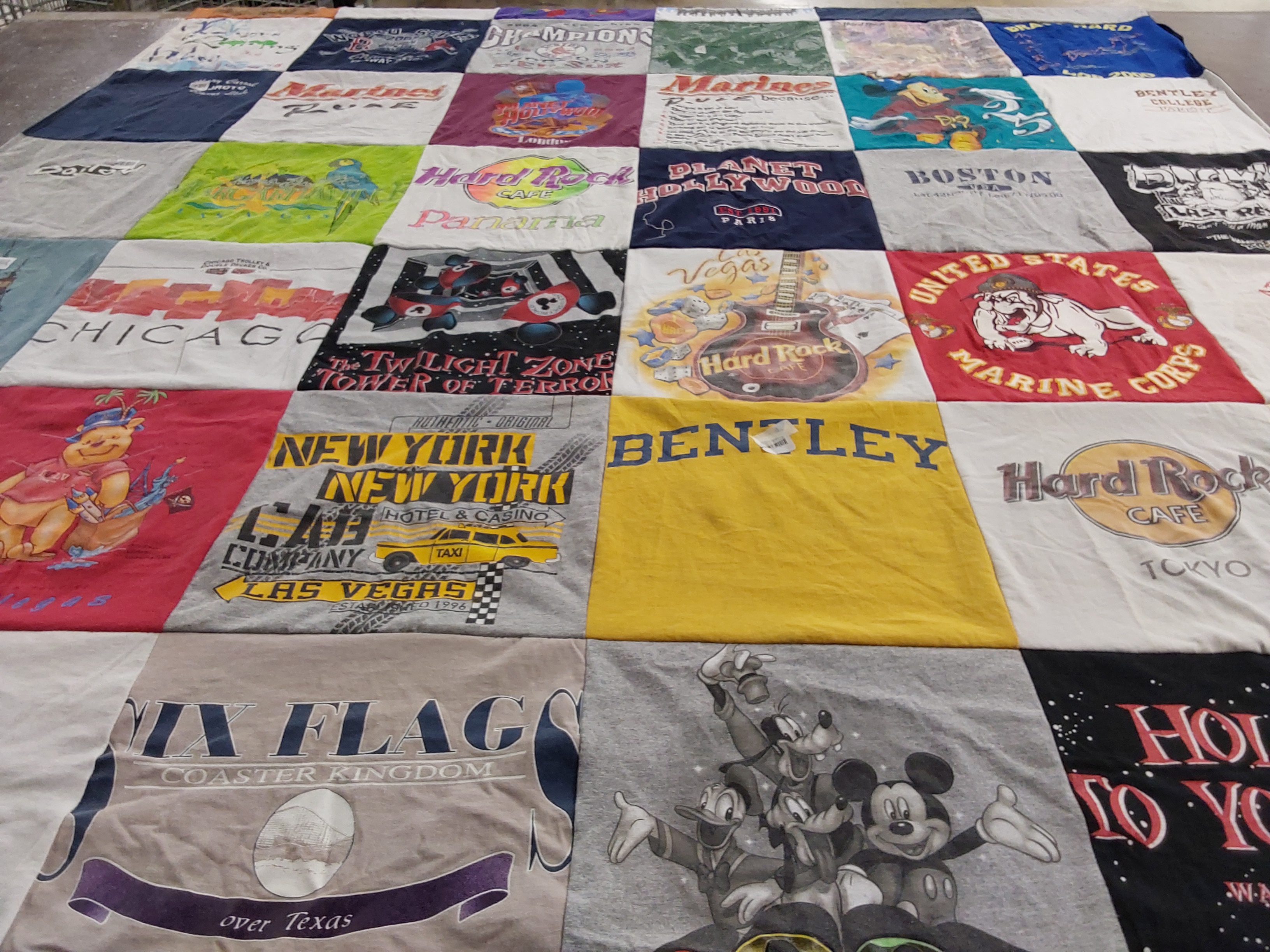 T-shirt quilt with travel, entertainment themes by Suzanne from TX