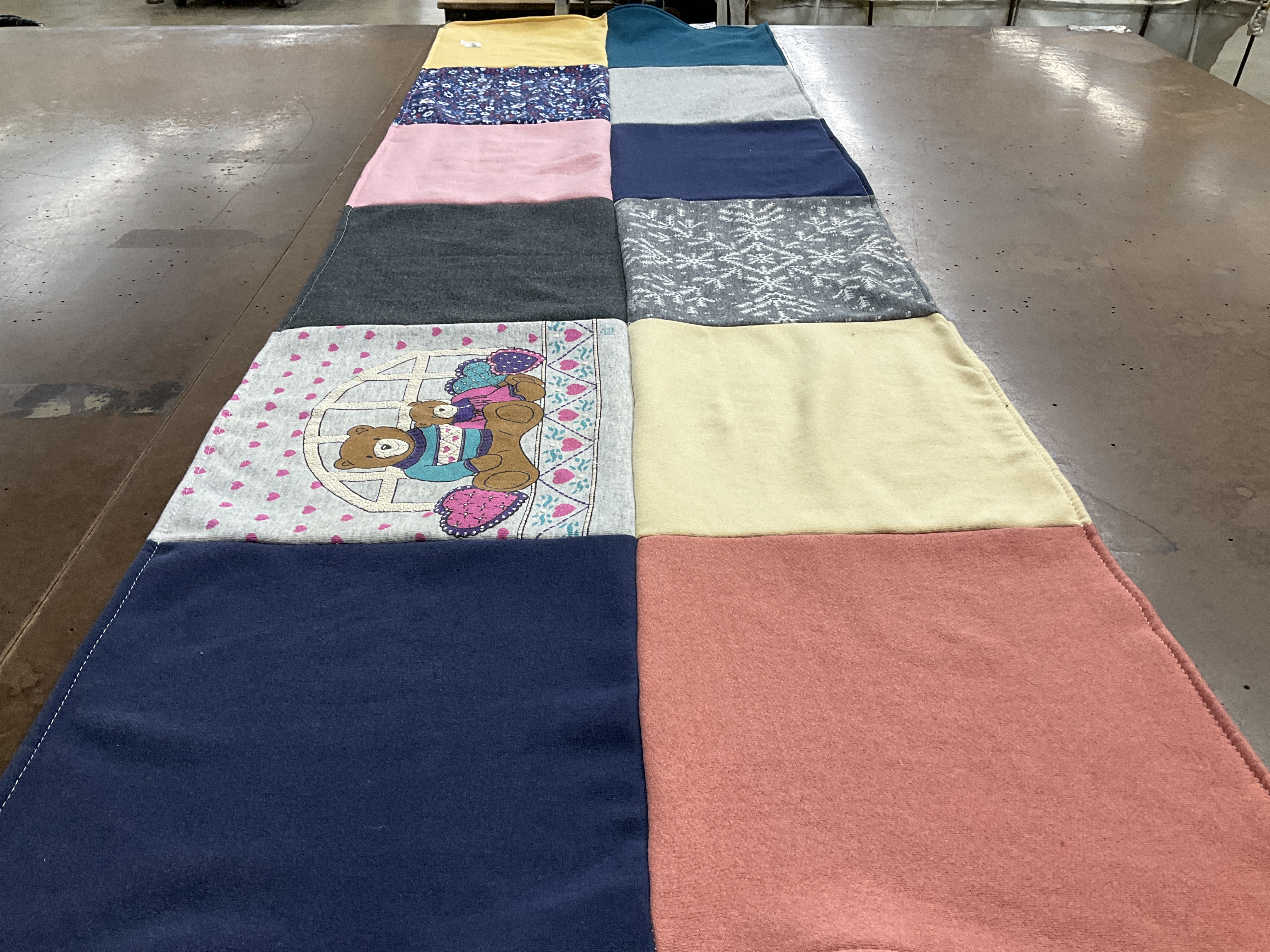 Custom Project Repat t-shirt quilt highlighting sewing, crafts themes.