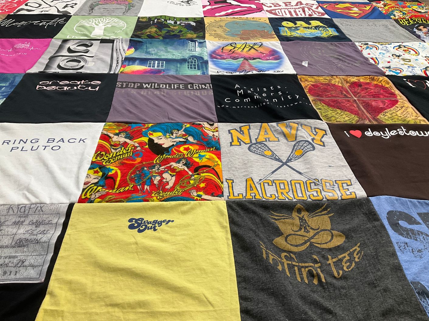 T-shirt quilt with wildlife conservation, sustainability themes by Shannon from PA