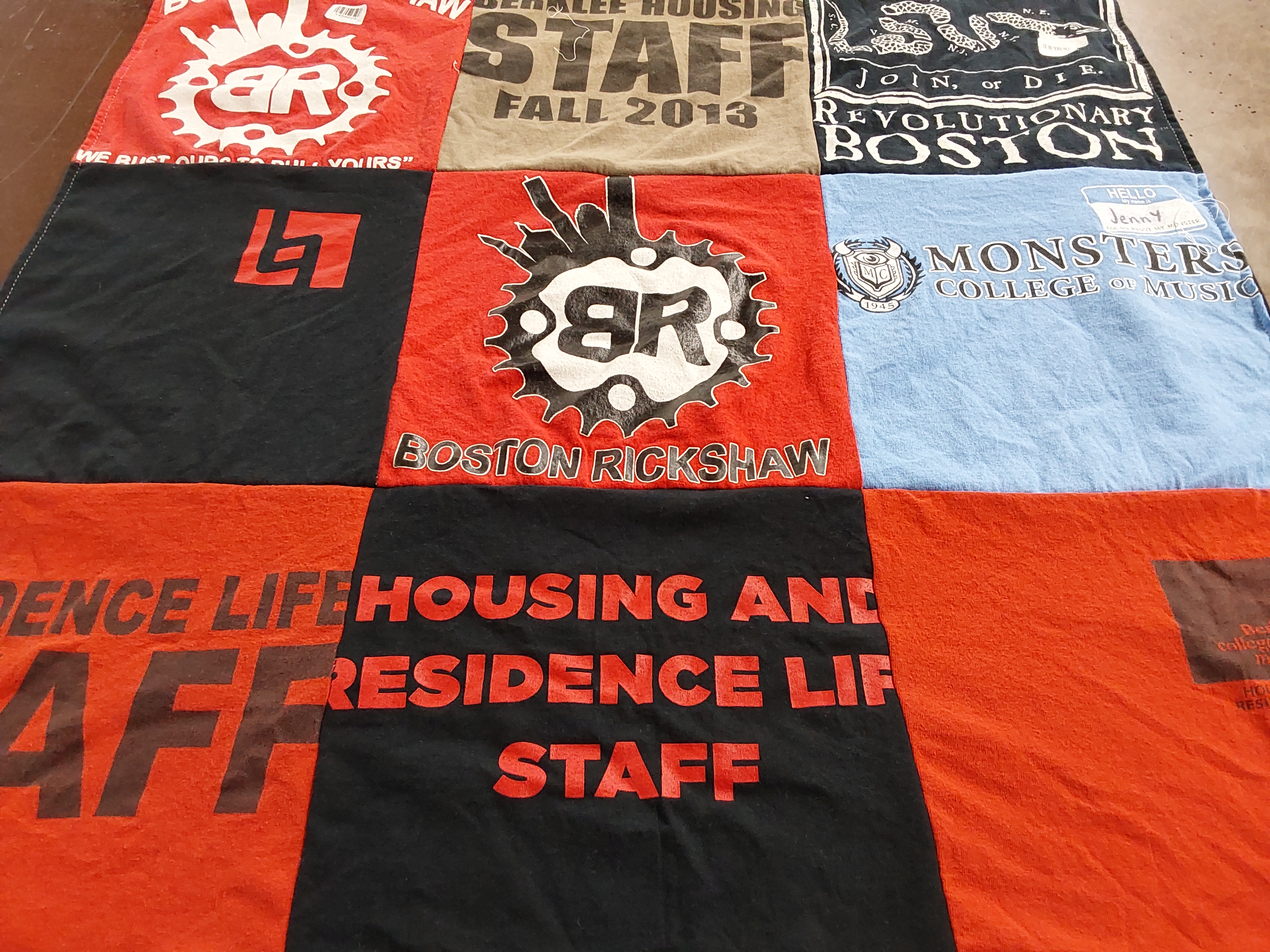 Custom Project Repat t-shirt quilt highlighting music, housing themes.
