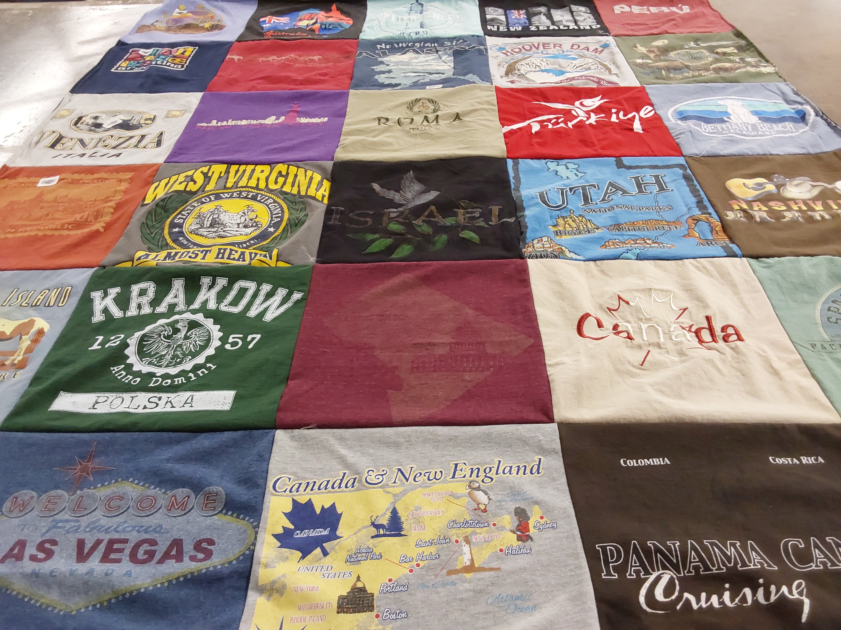 T-shirt quilt with traveling, tourism themes by Kris from FL