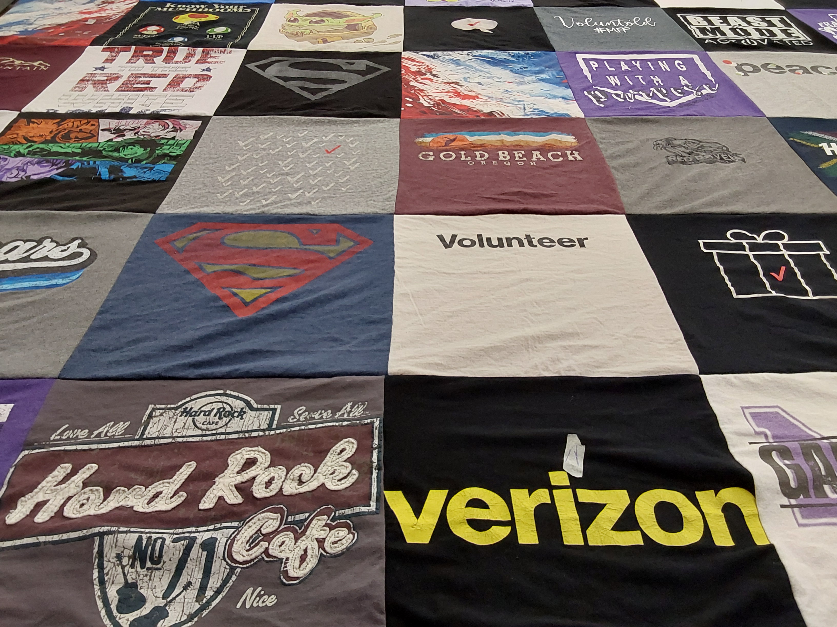 T-shirt quilt with volunteering, beach themes by Bennie from TX