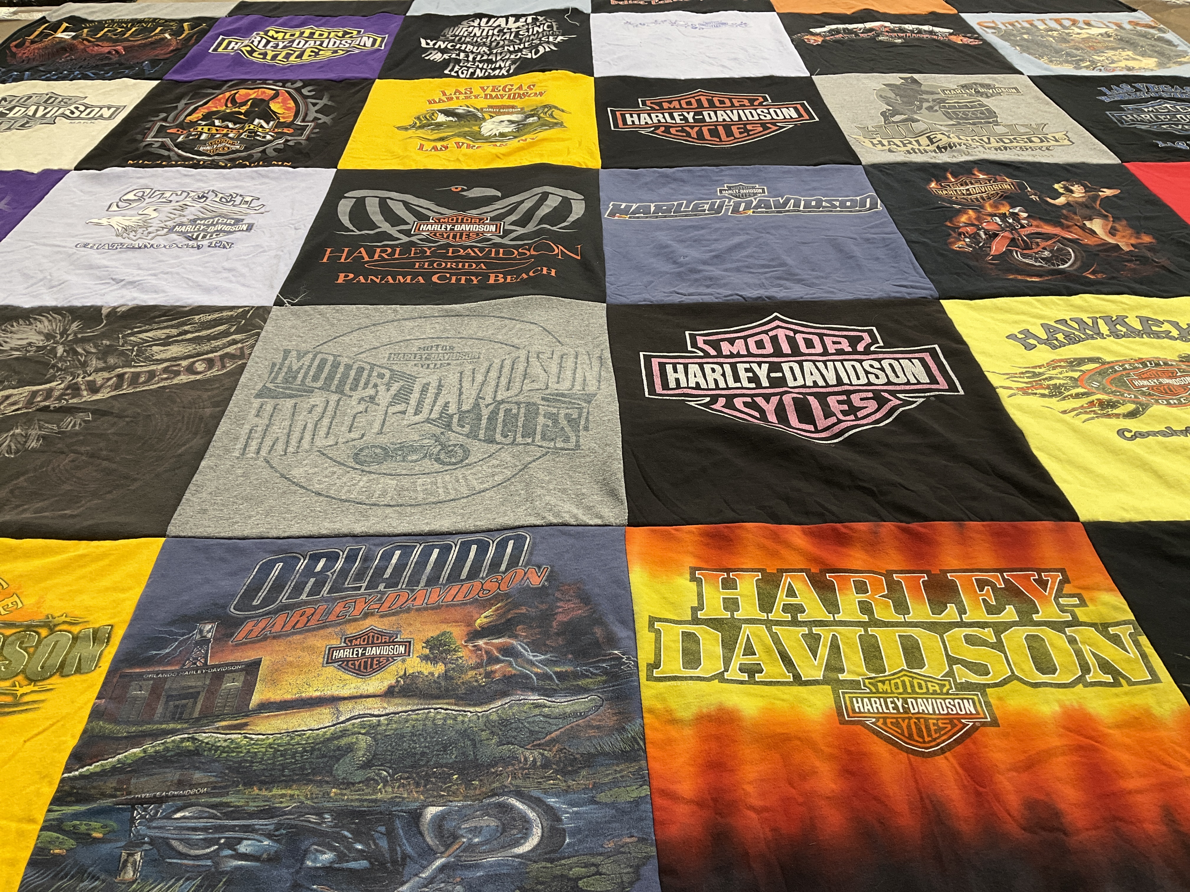 Custom Project Repat t-shirt quilt highlighting motorcycles, biking themes.