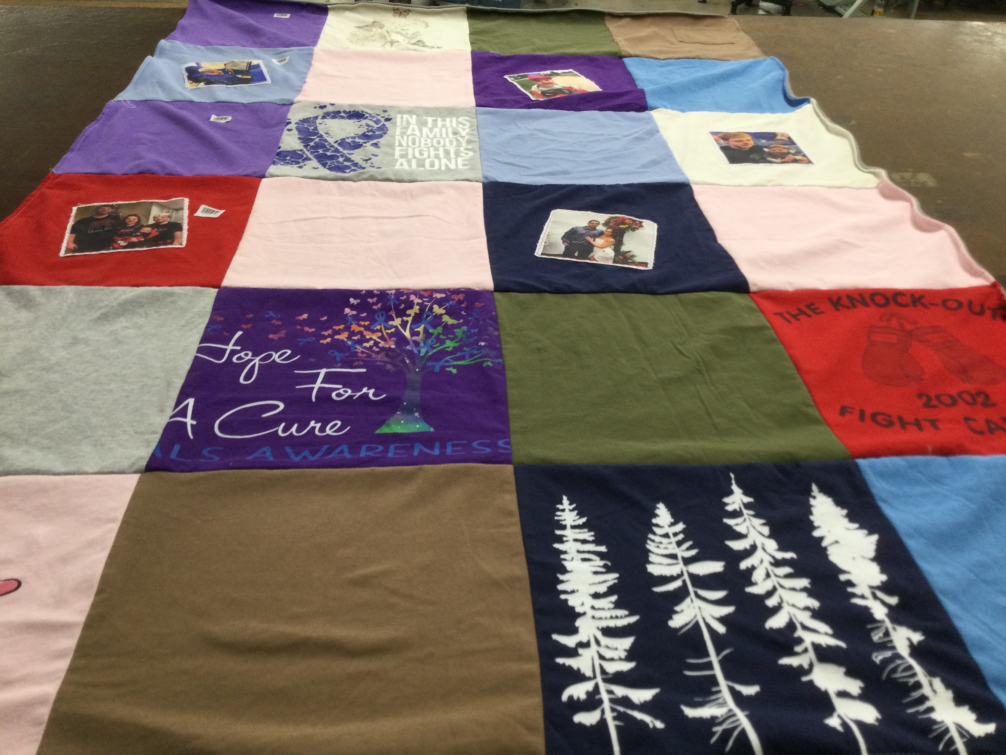 T-shirt quilt with awareness, charity themes by ELAINE from WI