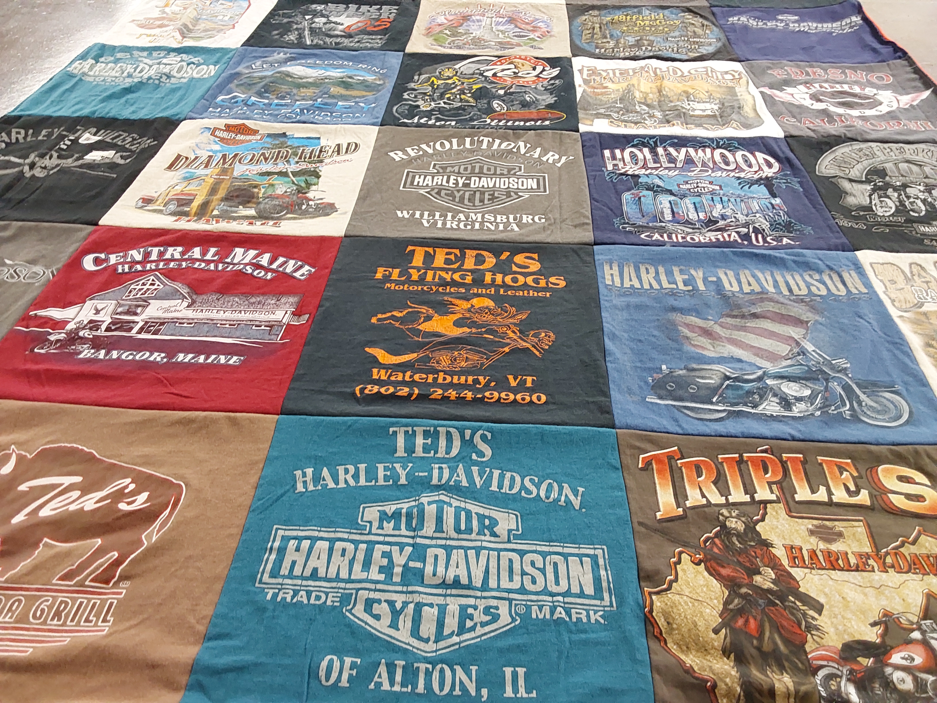 Custom Project Repat t-shirt quilt highlighting motorcycles, biking themes.