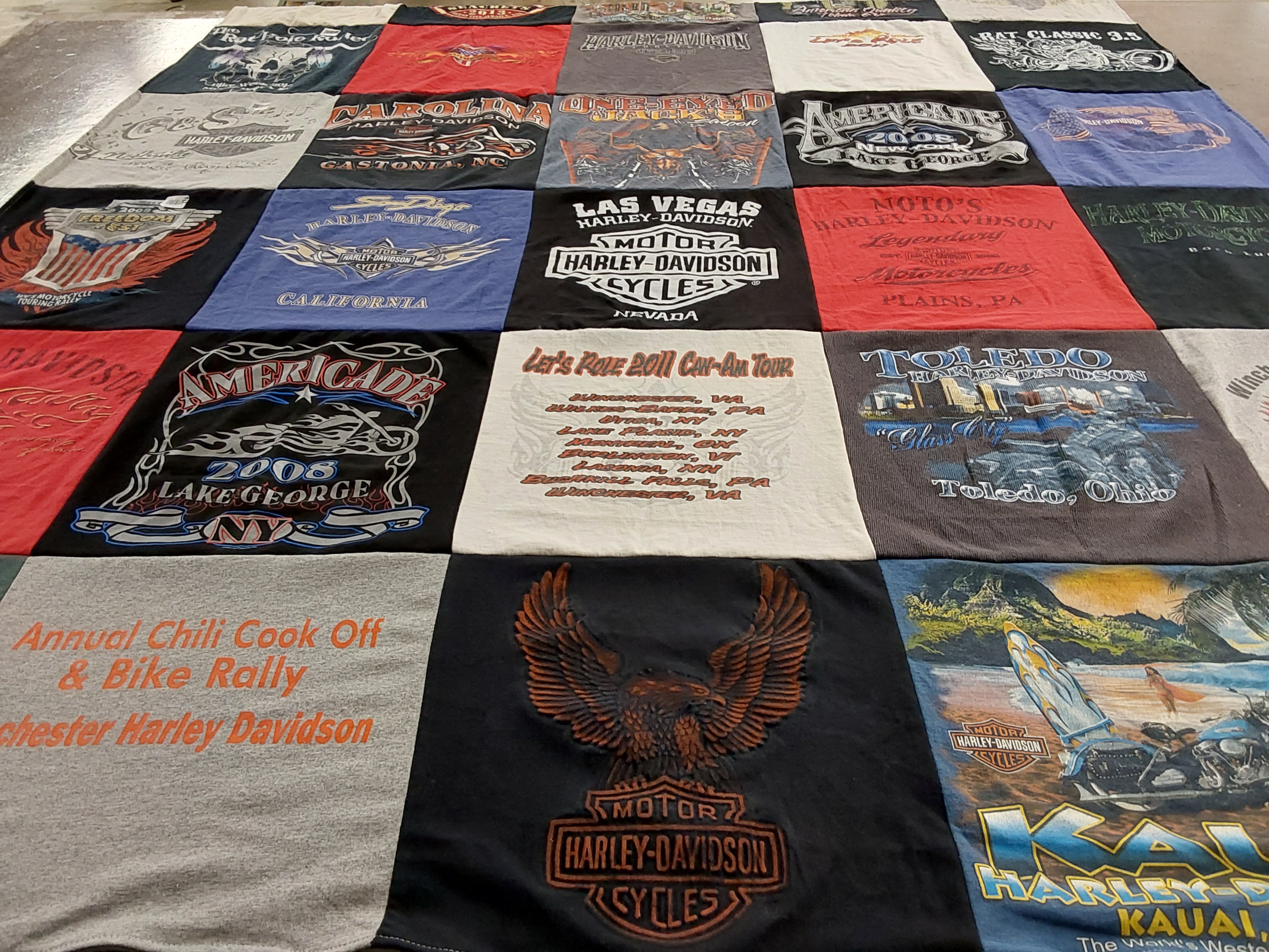 Custom Project Repat t-shirt quilt highlighting motorcycles, biking themes.