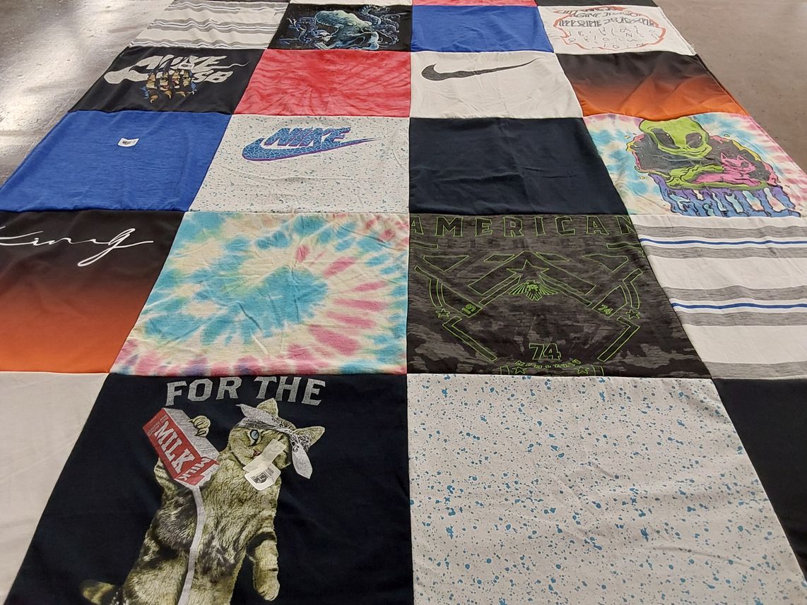 T-shirt quilt with sports, fashion themes by Angela from IA