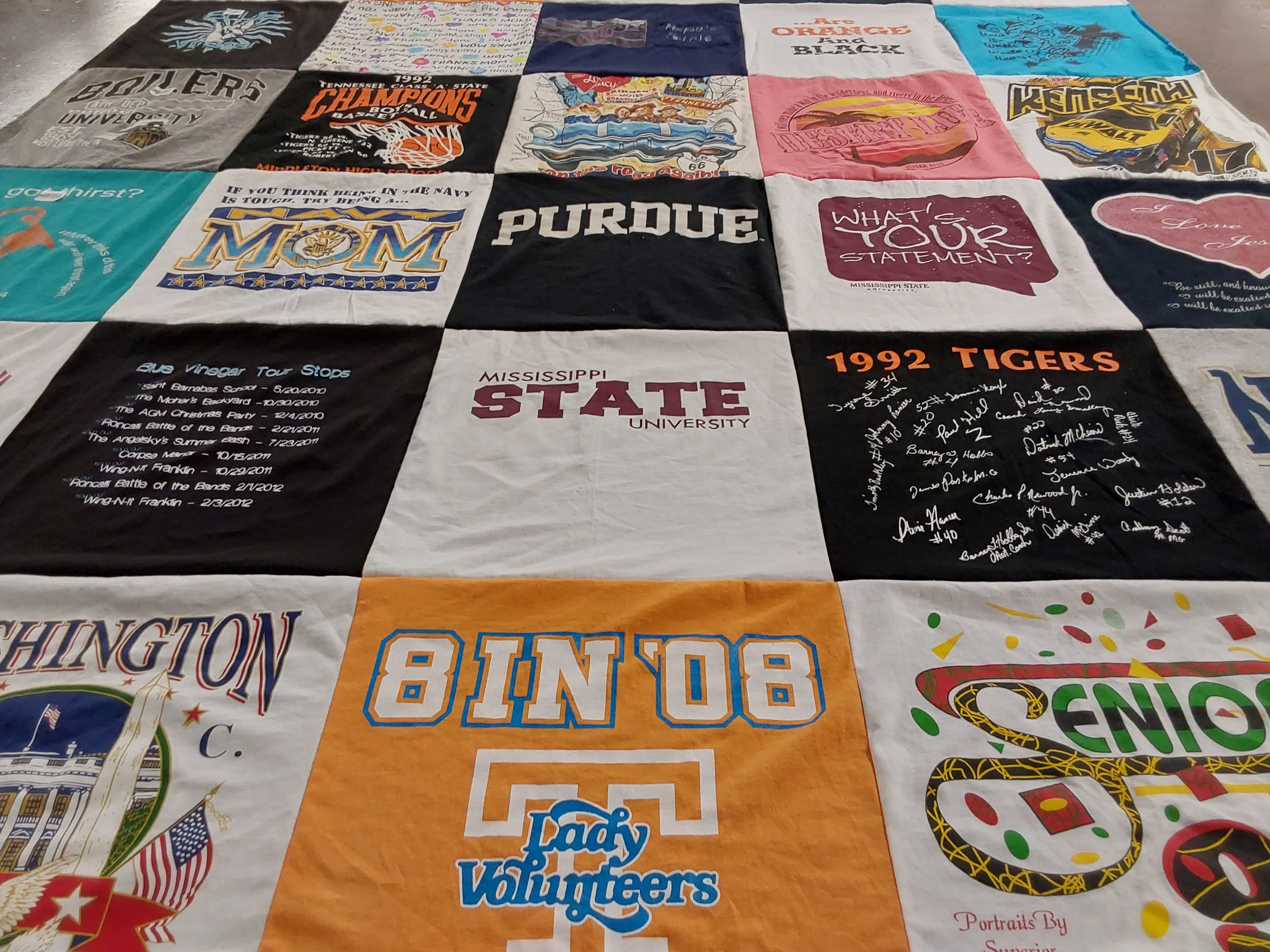 Custom Project Repat t-shirt quilt featuring shirts from purdue university, mississippi state university.