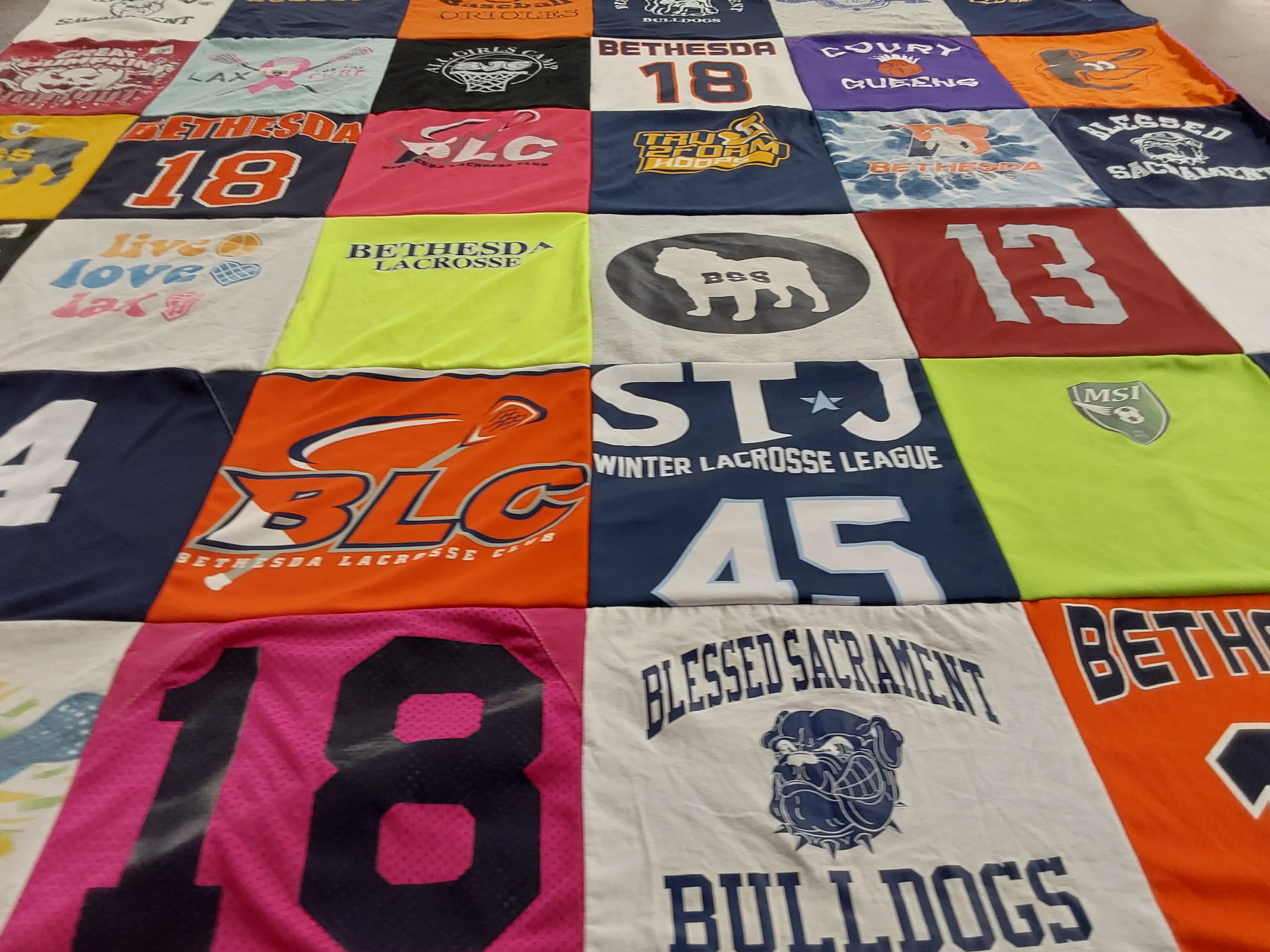 T-shirt quilt featuring bethesda lacrosse club, blessed sacrament bulldogs by Elizabeth from MD