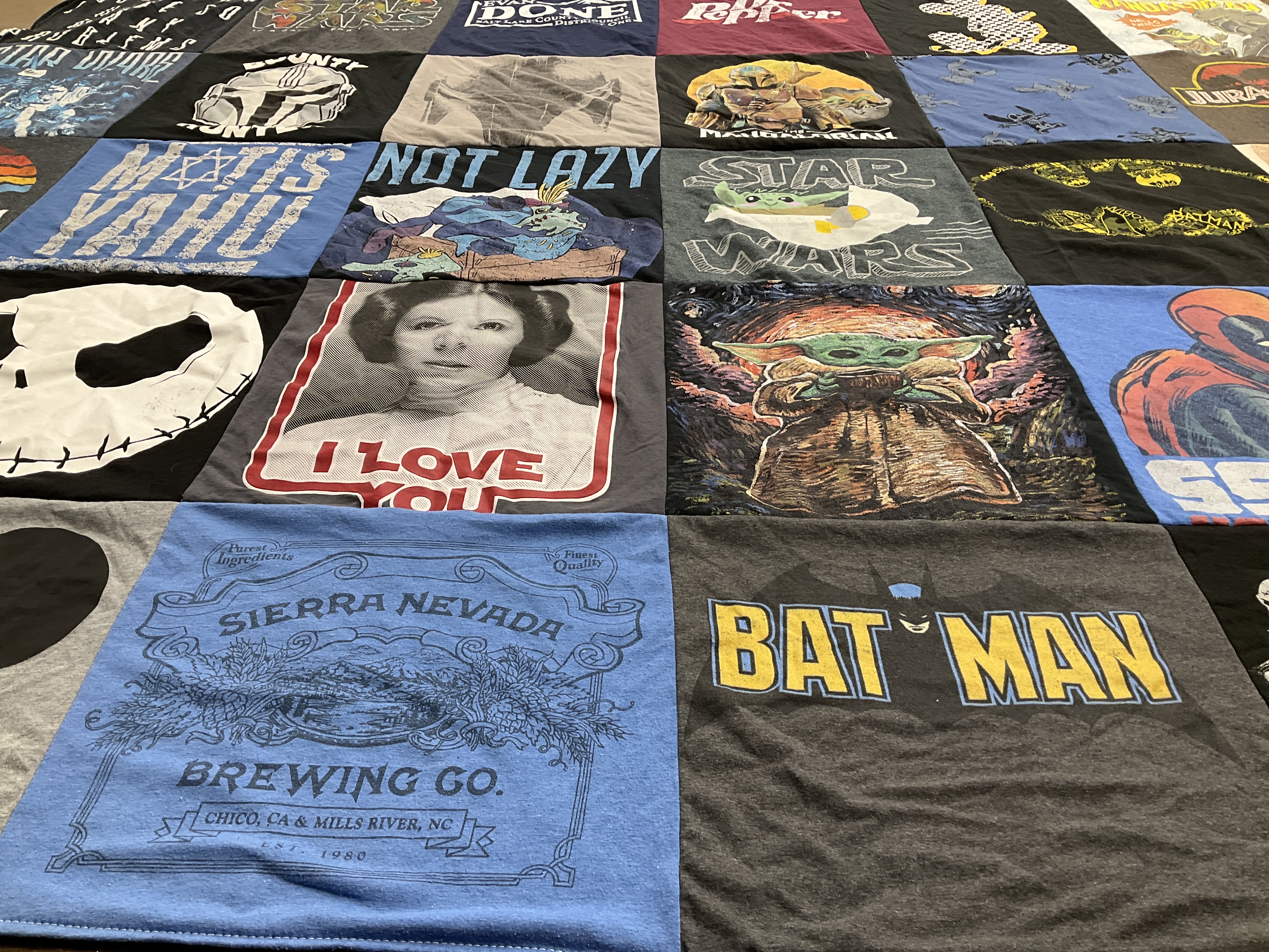 Custom Project Repat t-shirt quilt highlighting star wars, batman themes.