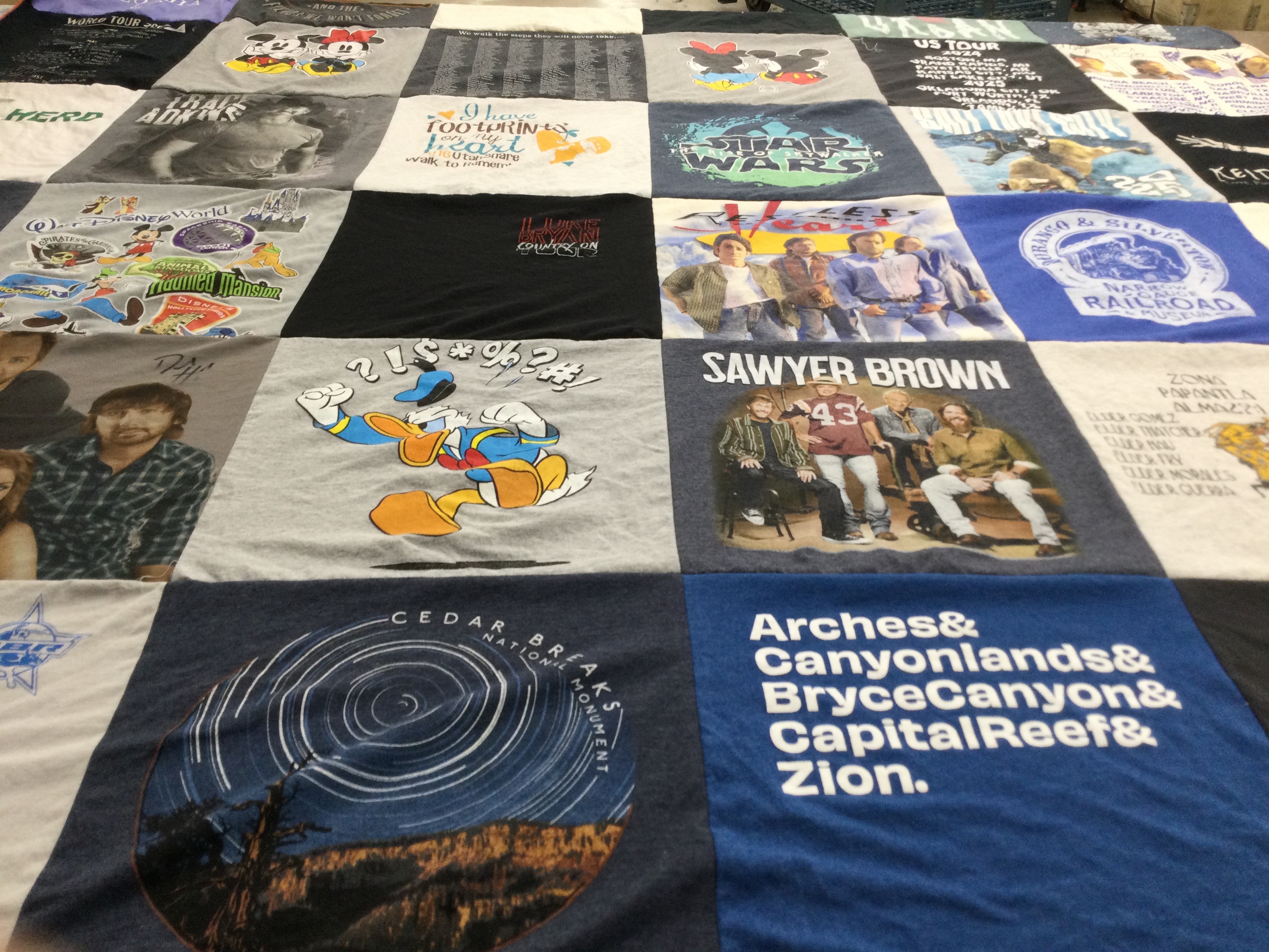 T-shirt quilt with theme parks, travel themes by Adele from UT