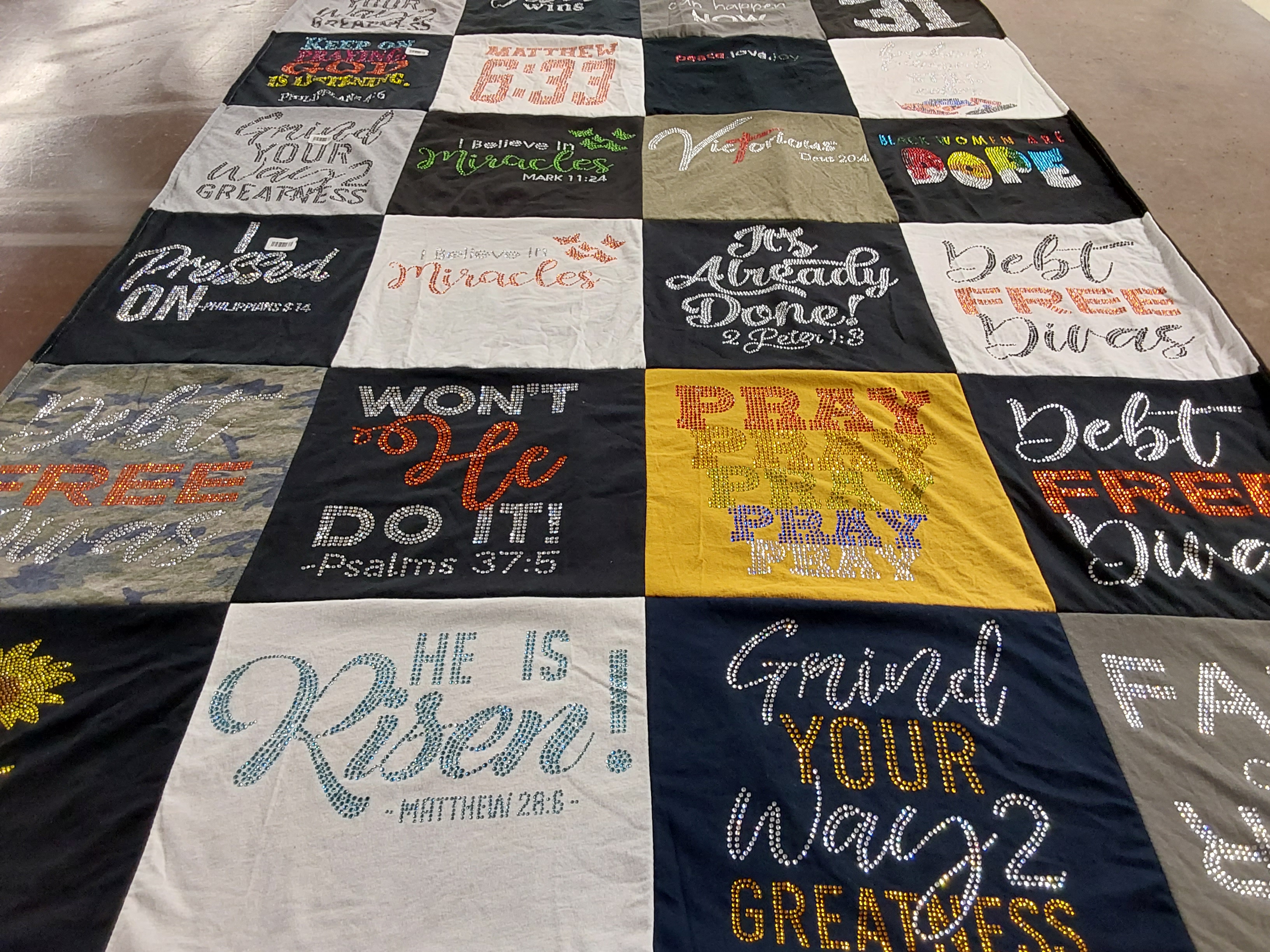 Custom Project Repat t-shirt quilt highlighting faith, motivational themes.
