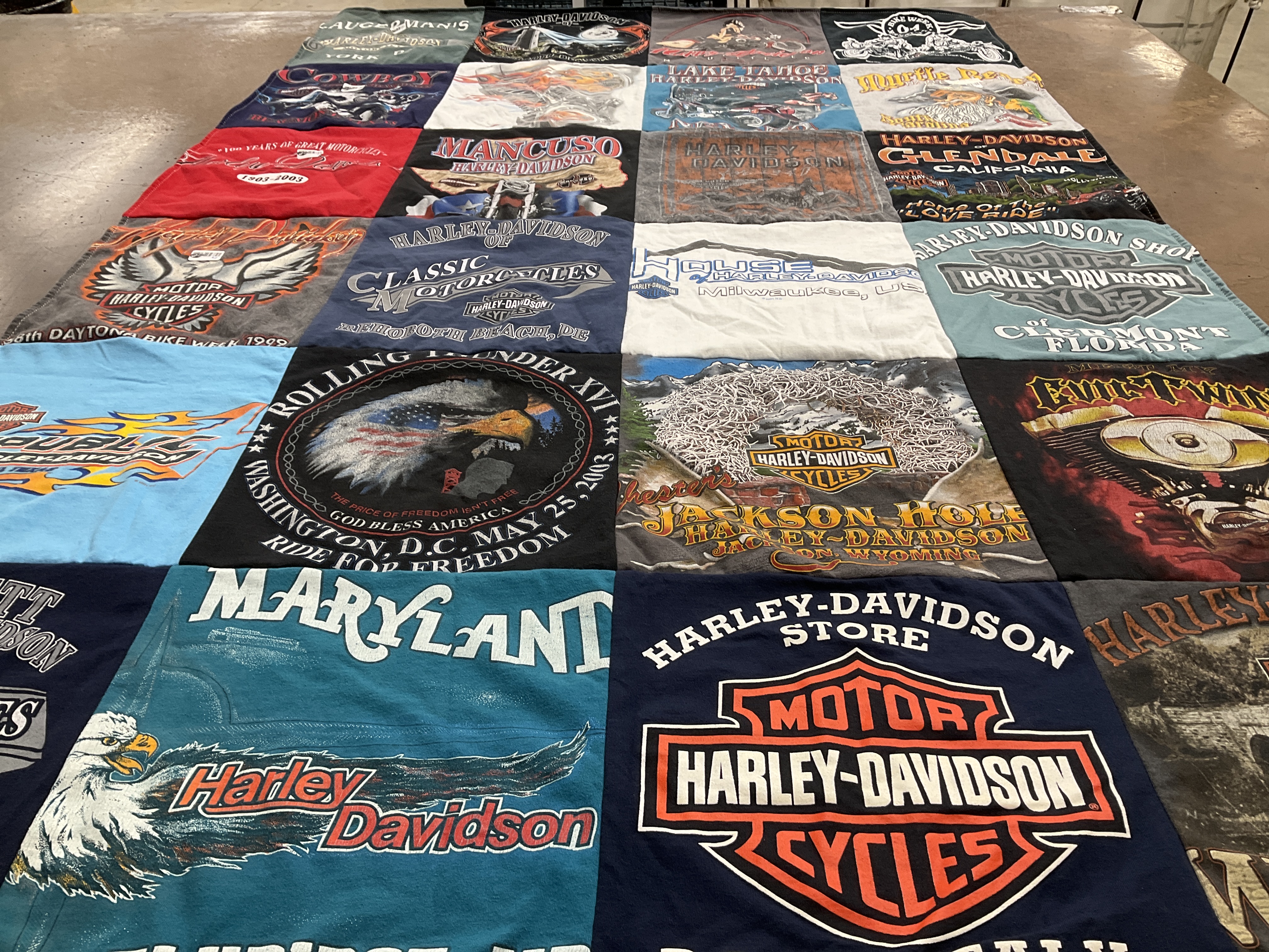Custom Project Repat t-shirt quilt highlighting motorcycles, biking themes.