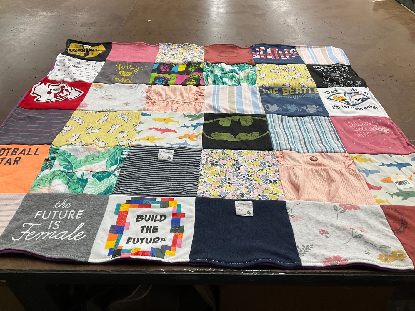 T-shirt quilt with music, sports themes by Jade from MN