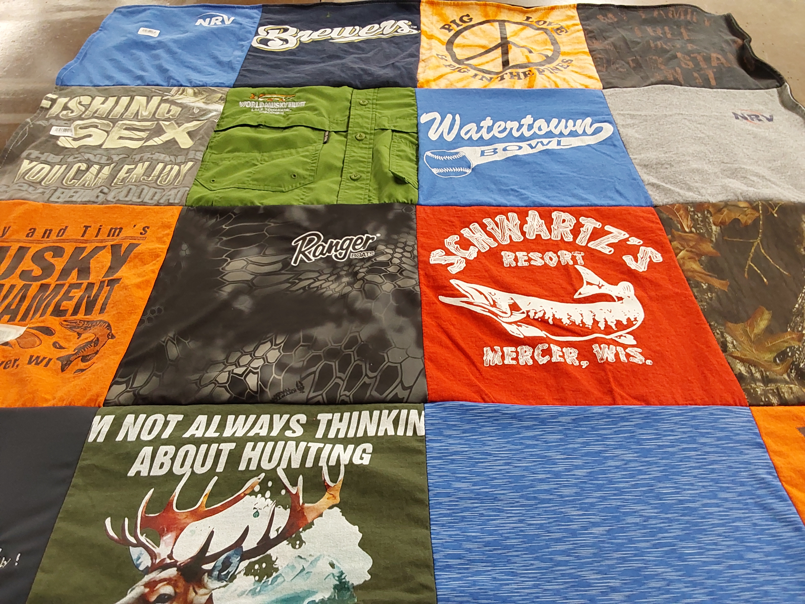 T-shirt quilt with fishing, hunting themes by Sally from WI