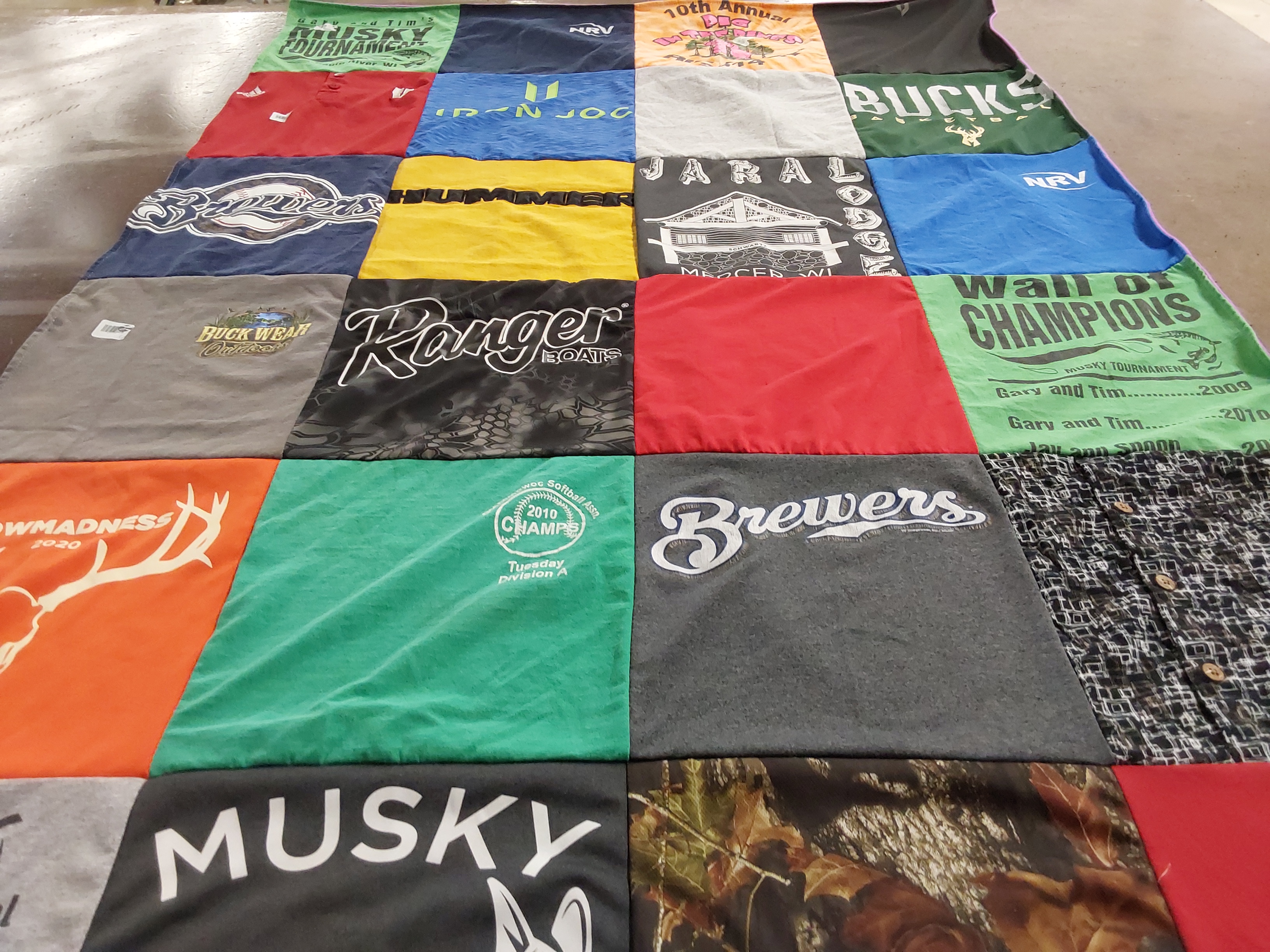 T-shirt quilt with hunting, fishing themes by Donna from WI