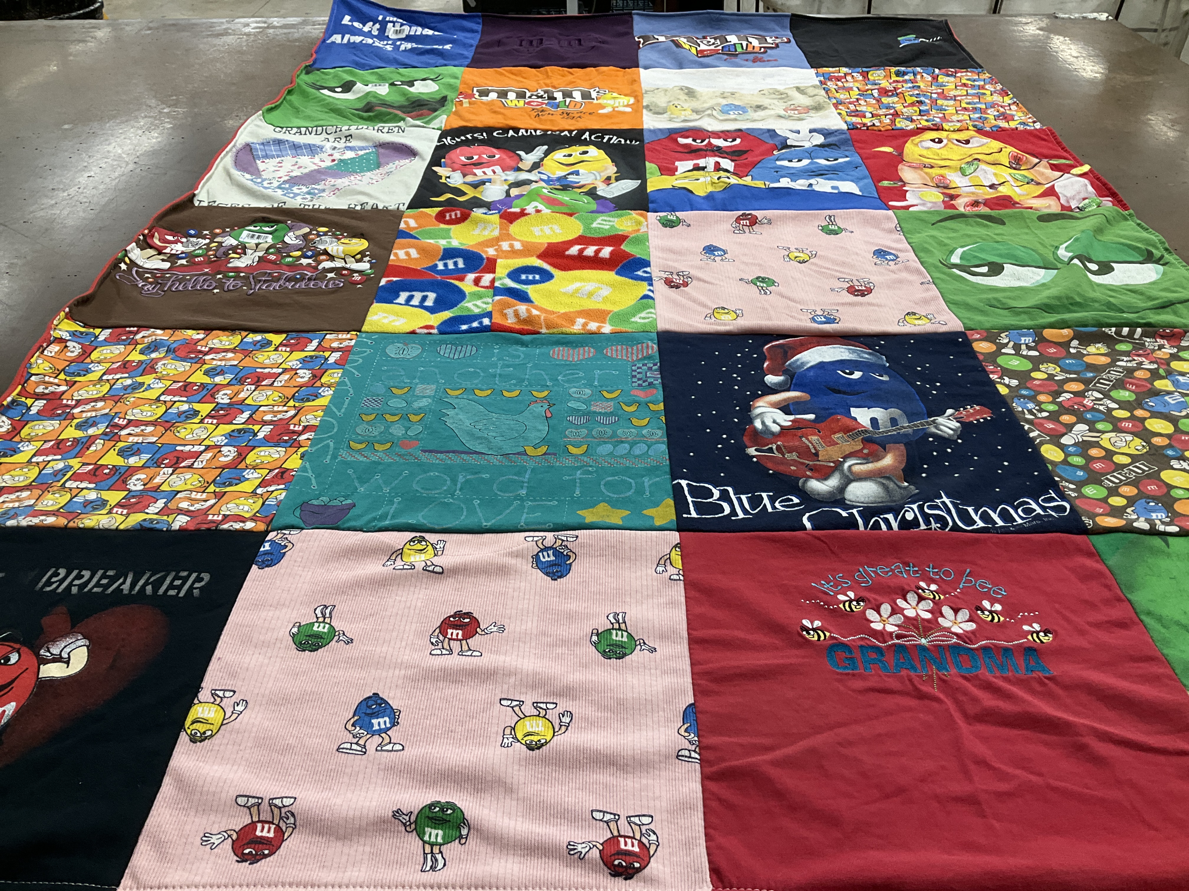 Custom Project Repat t-shirt quilt highlighting m&ms, desserts themes.