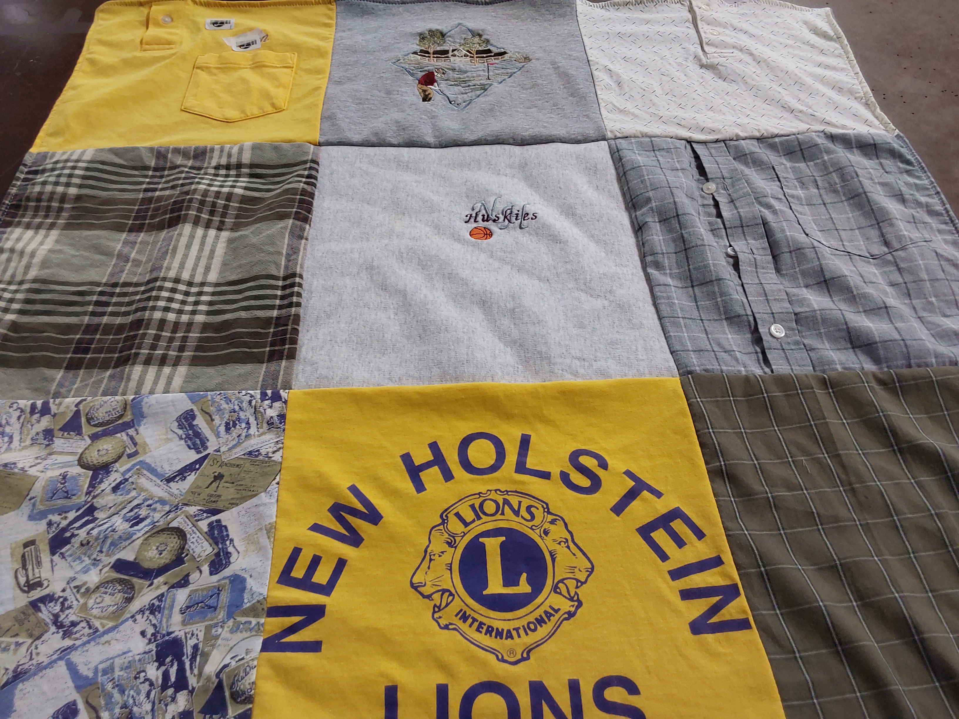 T-shirt quilt with sports, community service themes by Suzy from WI