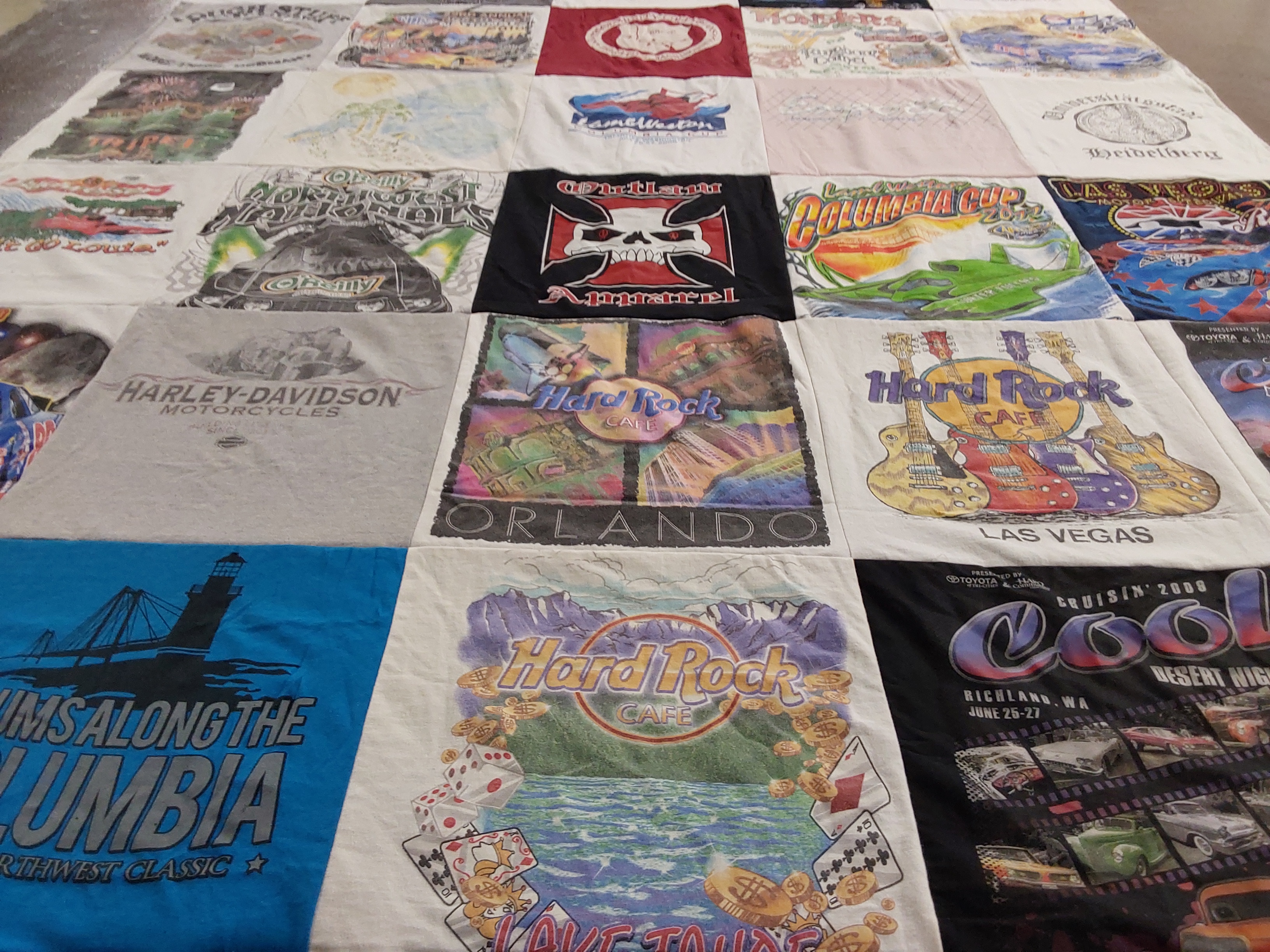 Custom Project Repat t-shirt quilt highlighting motorcycles, music themes.