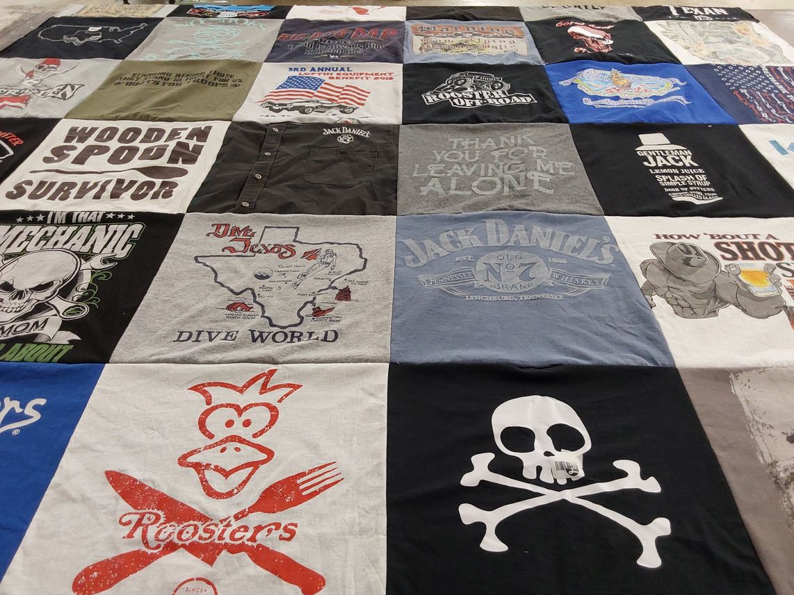 T-shirt quilt with whiskey, cooking themes by Leah from TX