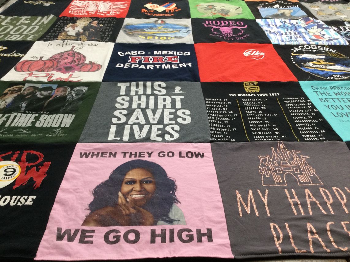 T-shirt quilt with music, activism themes by Nancy from CA