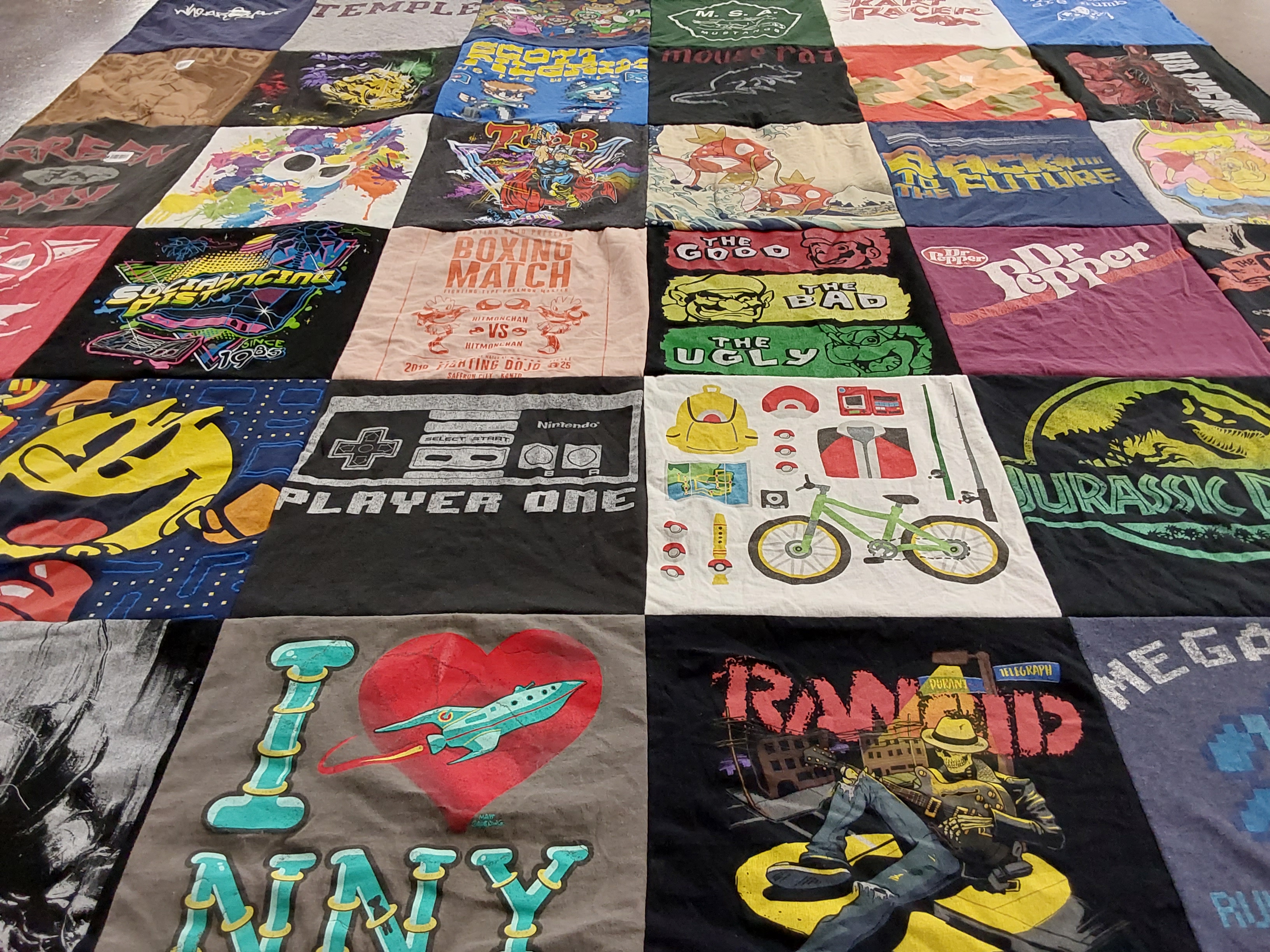 T-shirt quilt with video games, movies themes by Ada from NJ