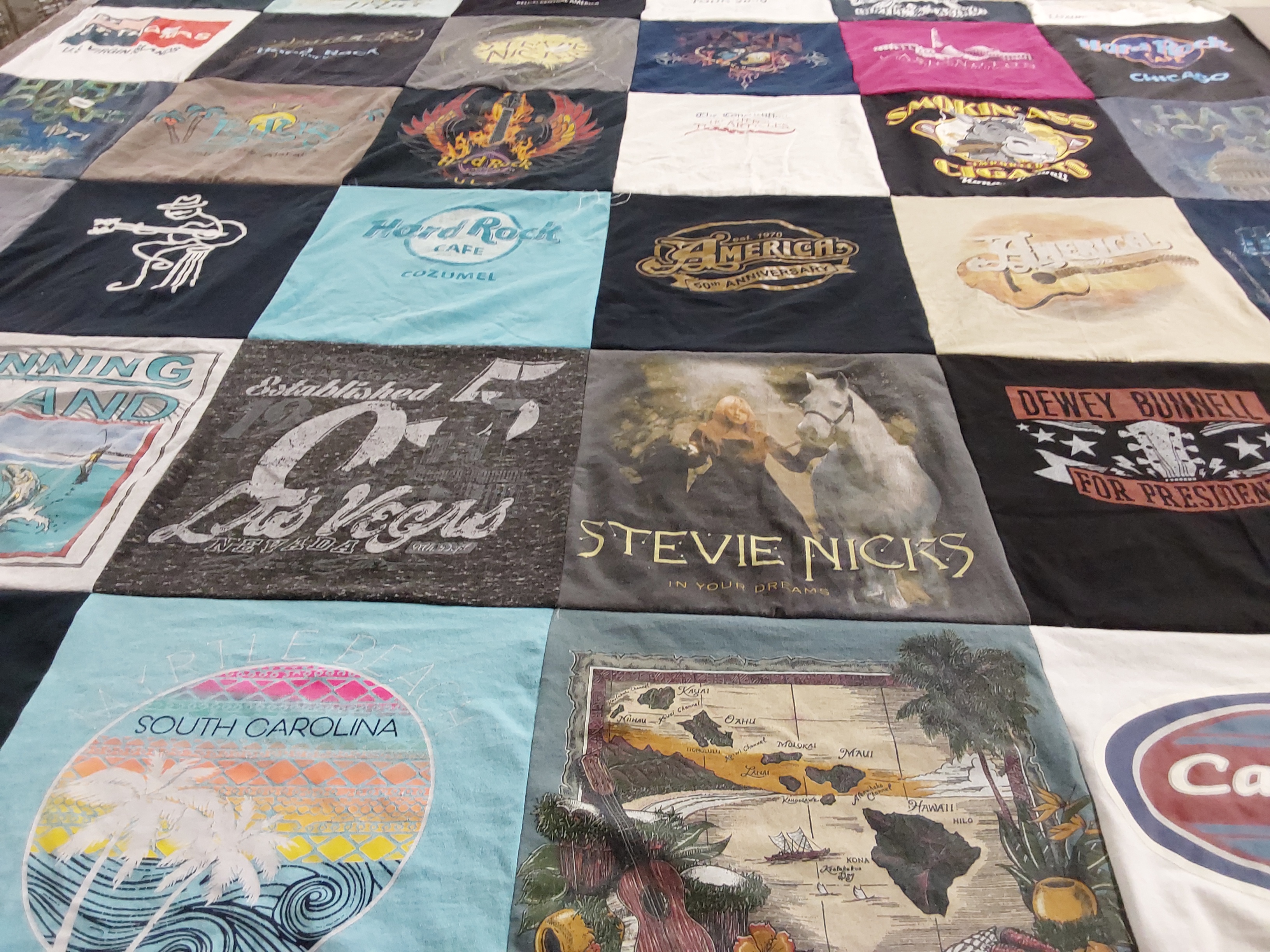 T-shirt quilt with travel, music themes by Vickie from OK