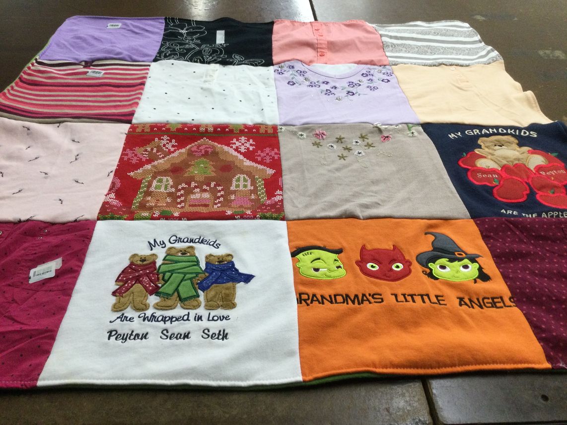T-shirt quilt with family themes by Tyra from OH