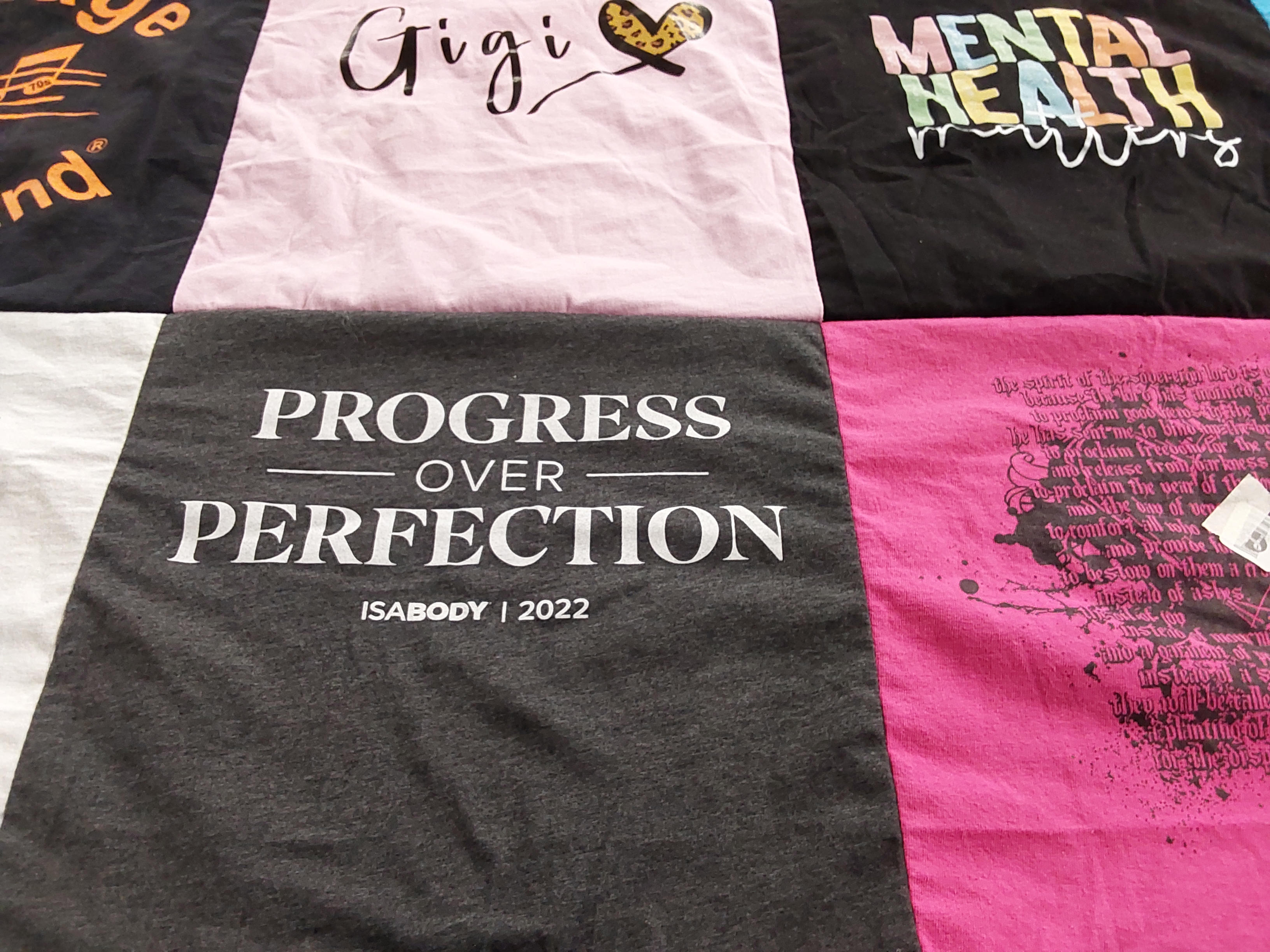 T-shirt quilt with personal development, mental health awareness themes by Esther from FL