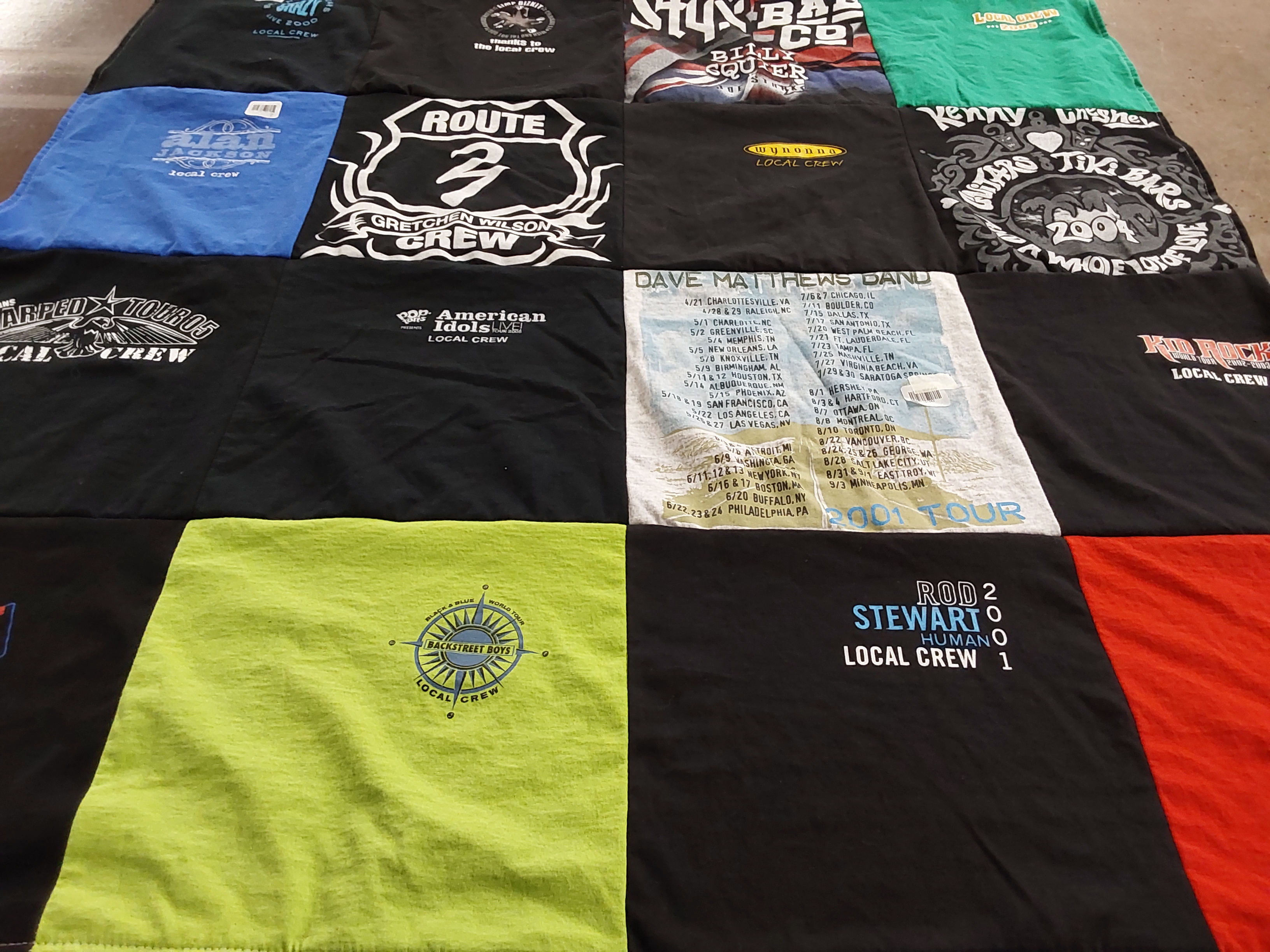 Custom Project Repat t-shirt quilt highlighting music, concerts themes.