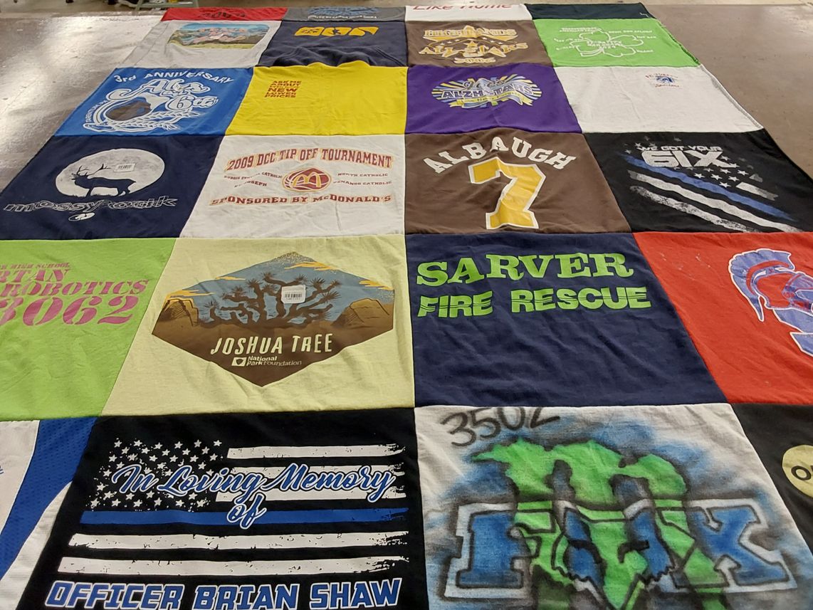 T-shirt quilt with robotics, national parks themes by Marian from PA