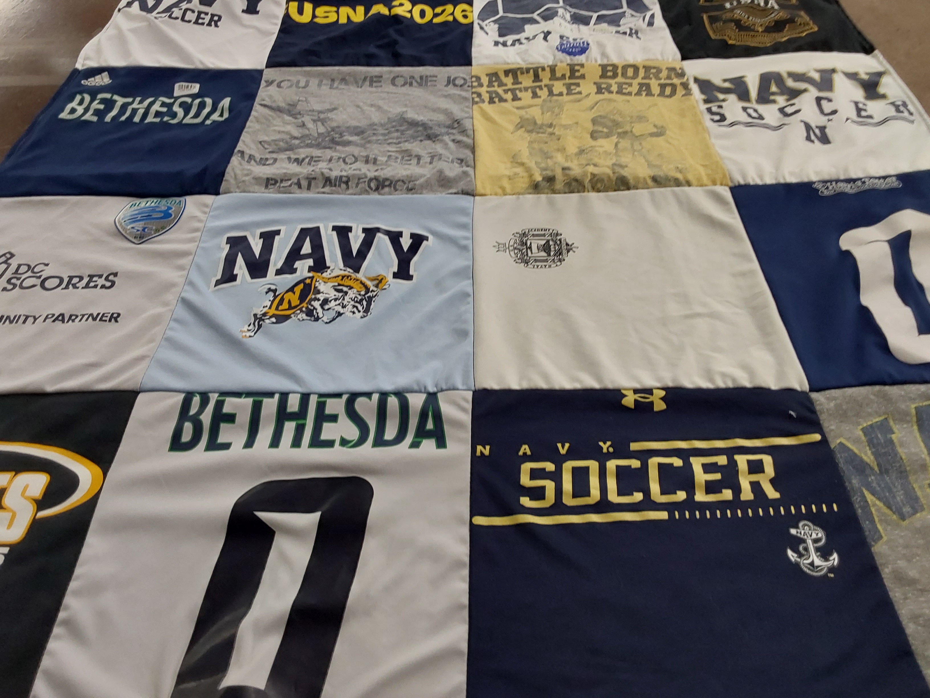 Custom Project Repat t-shirt quilt featuring shirts from united states naval academy.