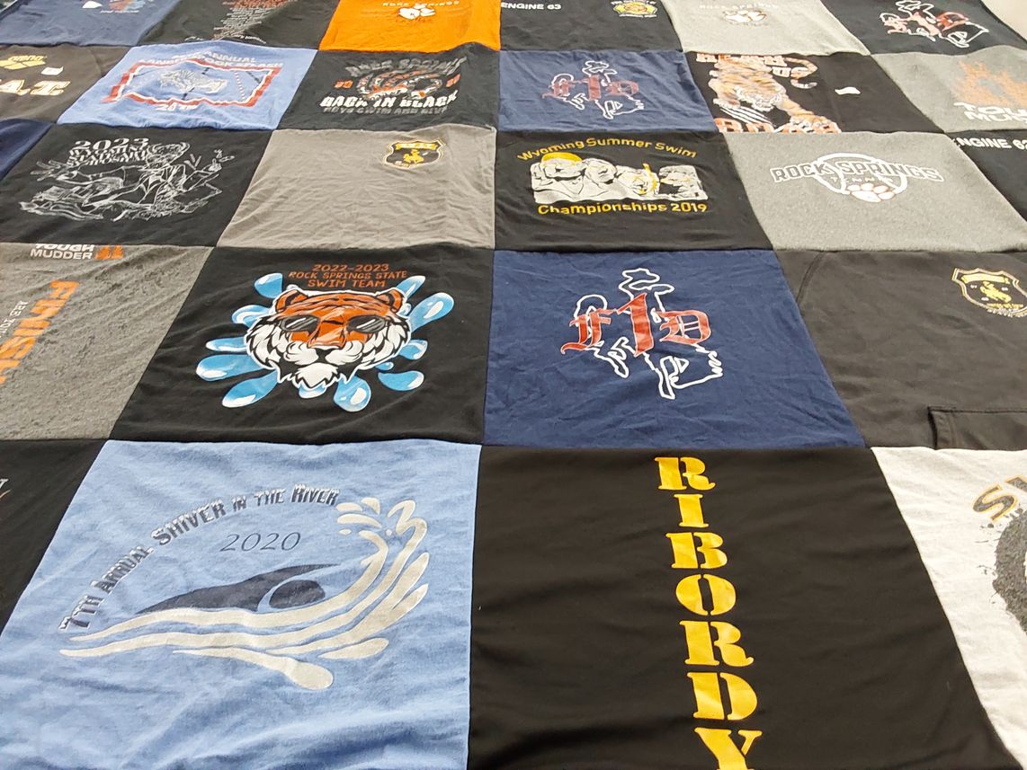T-shirt quilt featuring rock springs swim team by Nichole from WY
