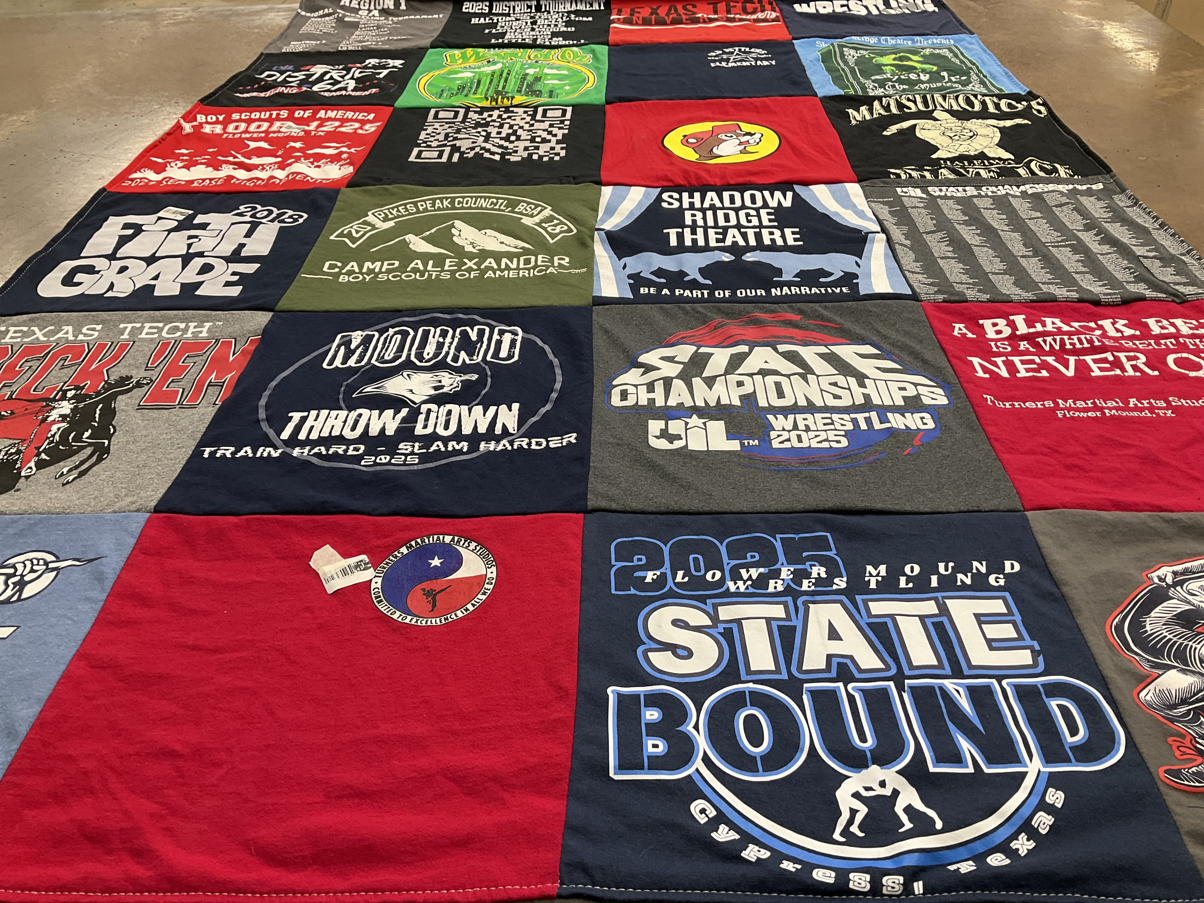 T-shirt quilt featuring flower mound wrestling by Cindy from TX