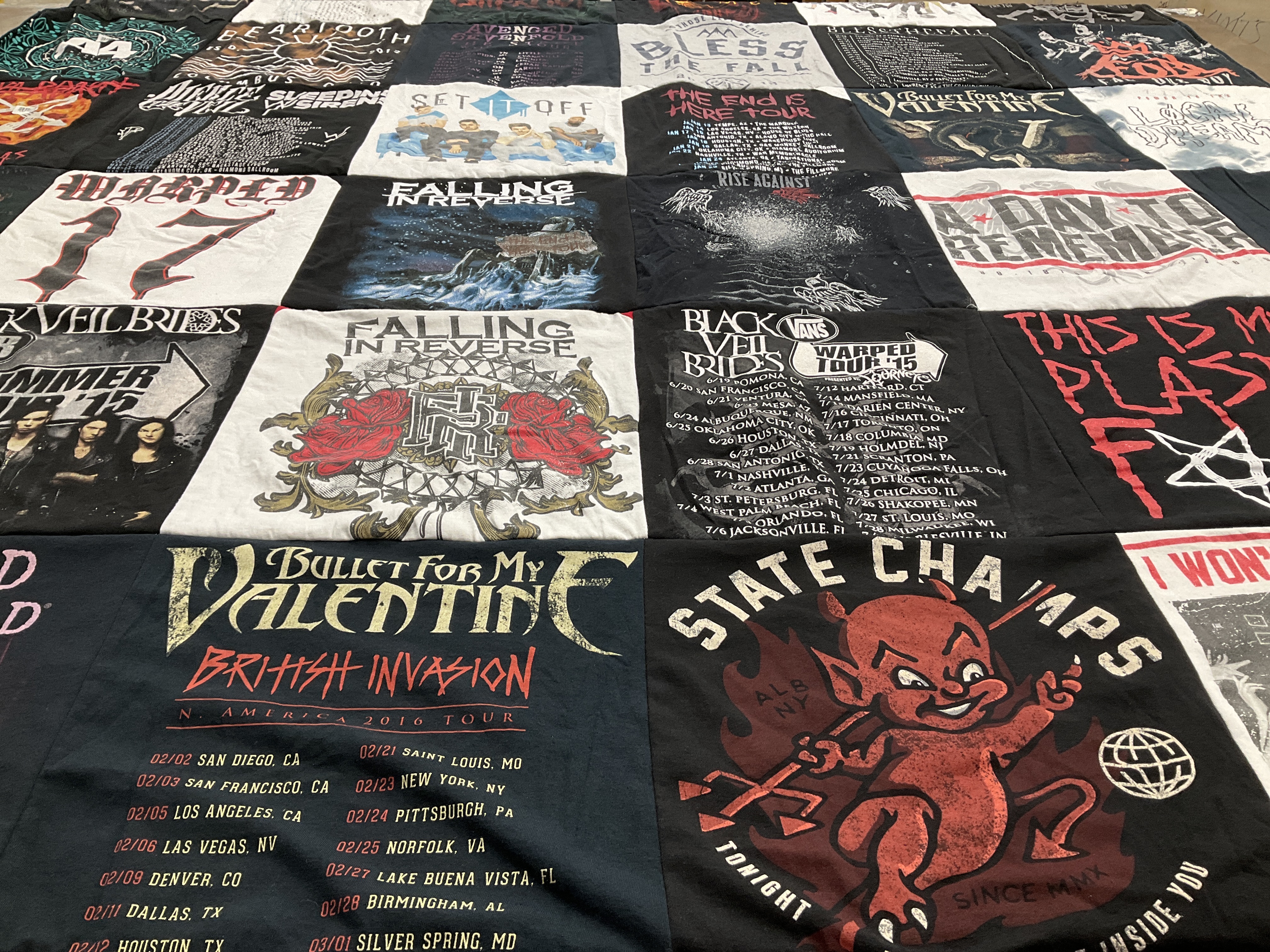 Custom Project Repat t-shirt quilt highlighting music, concerts themes.