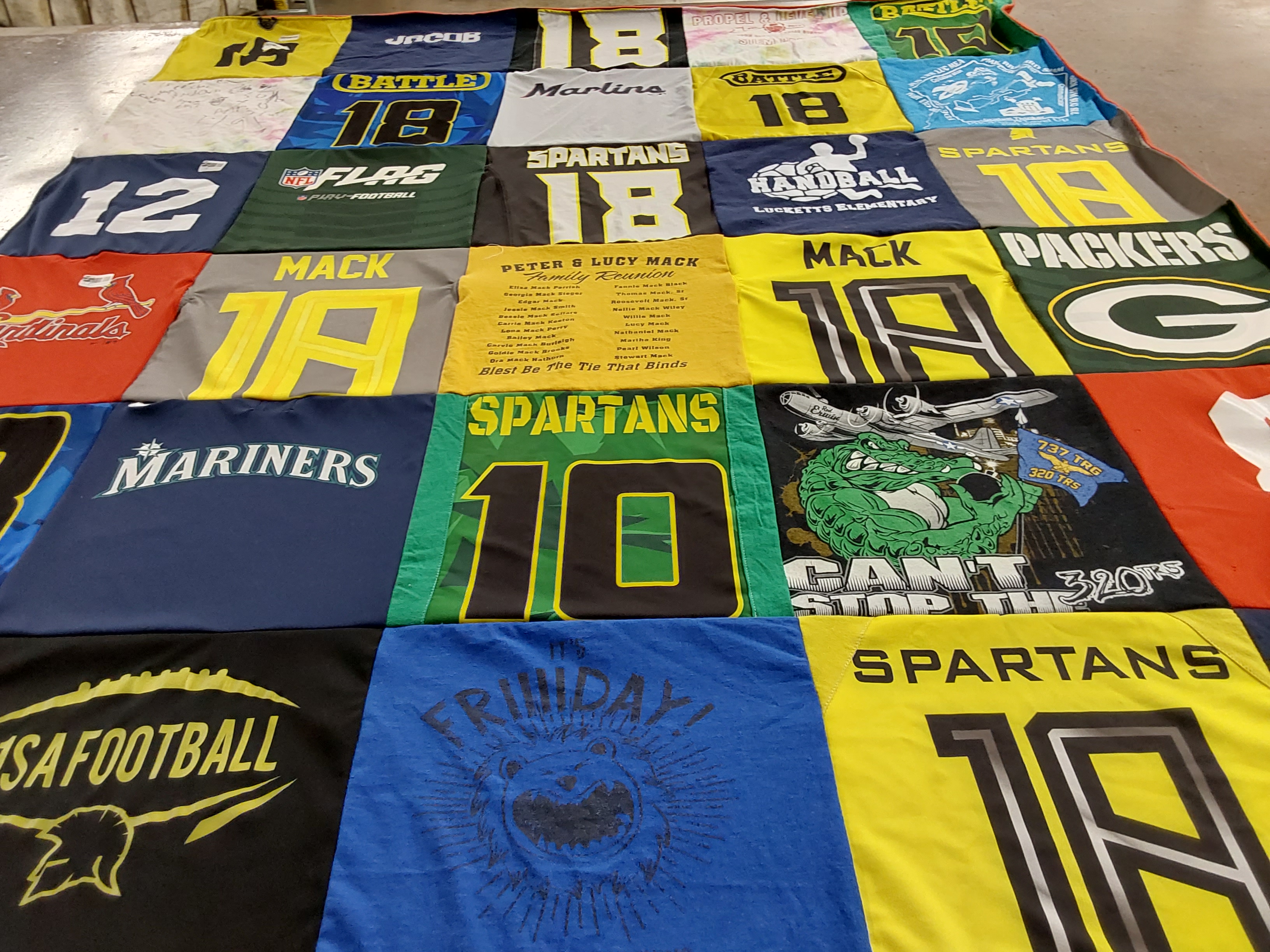 T-shirt quilt featuring green bay packers, sparta spartans by Stephanie from VA