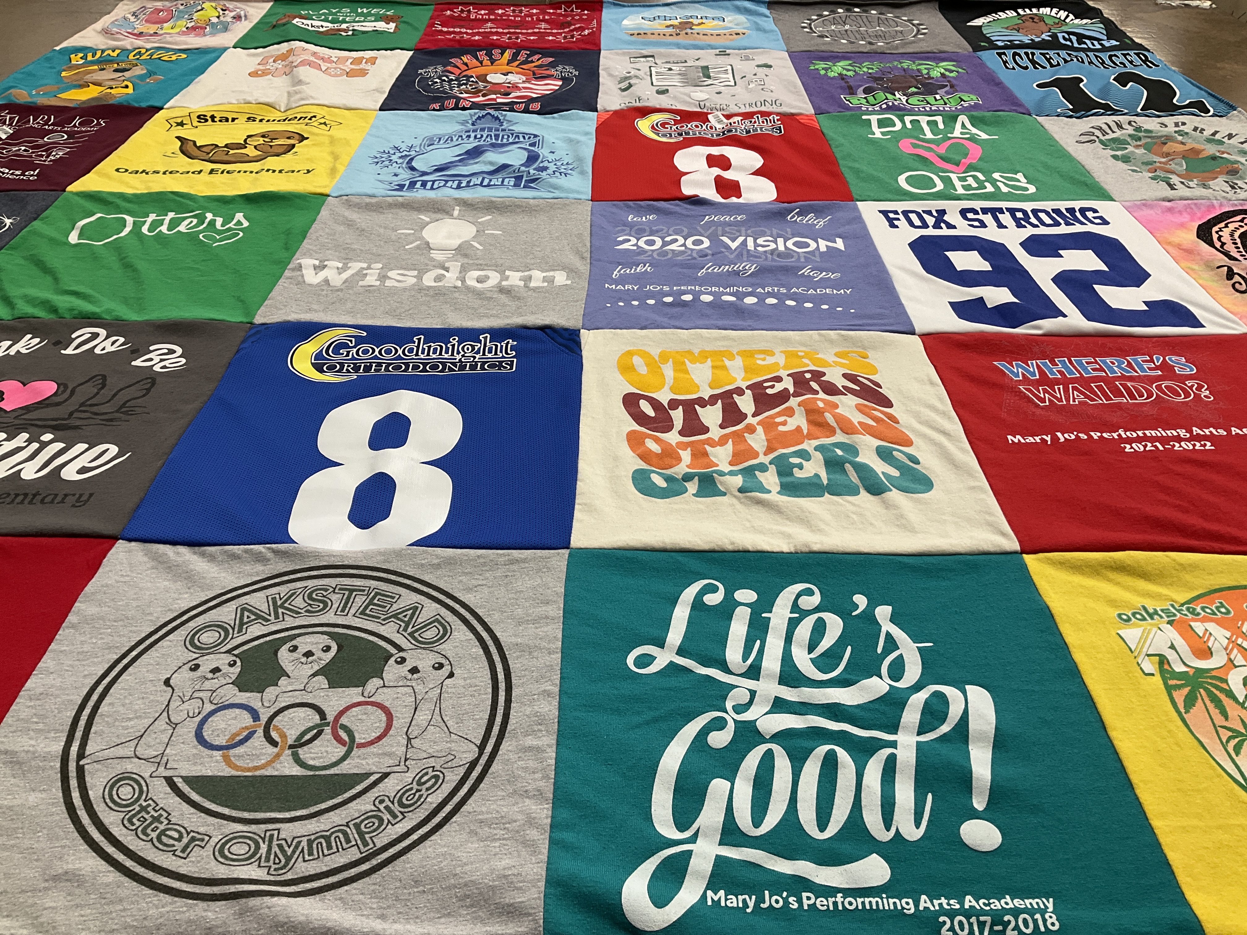 Custom Project Repat t-shirt quilt featuring shirts from oakstead elementary.
