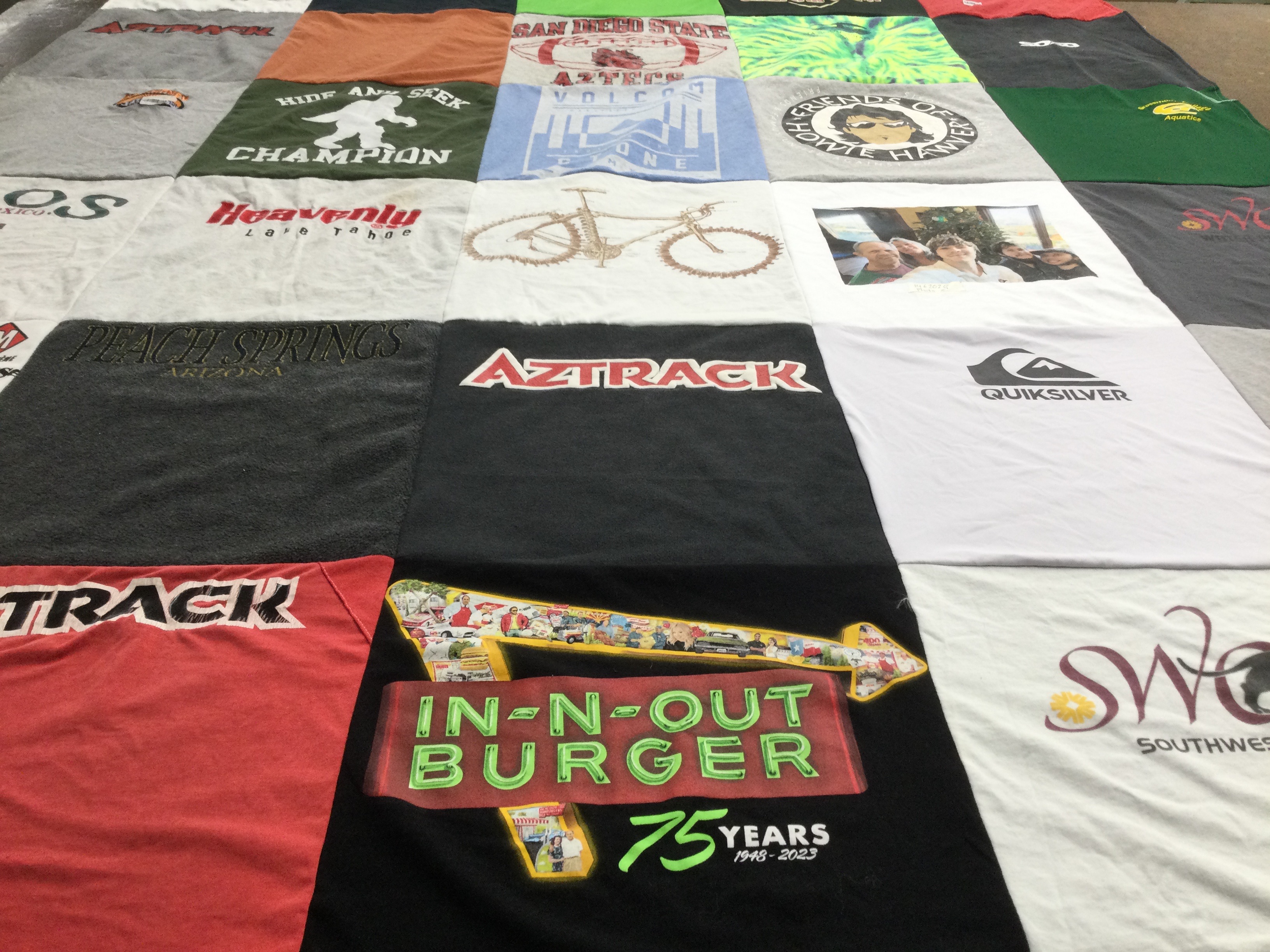 T-shirt quilt with food, outdoor activities themes by Gloria from CA
