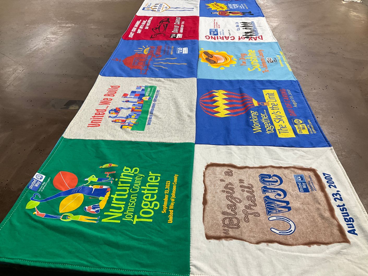 T-shirt quilt with community service, collaboration themes by Bob from IN