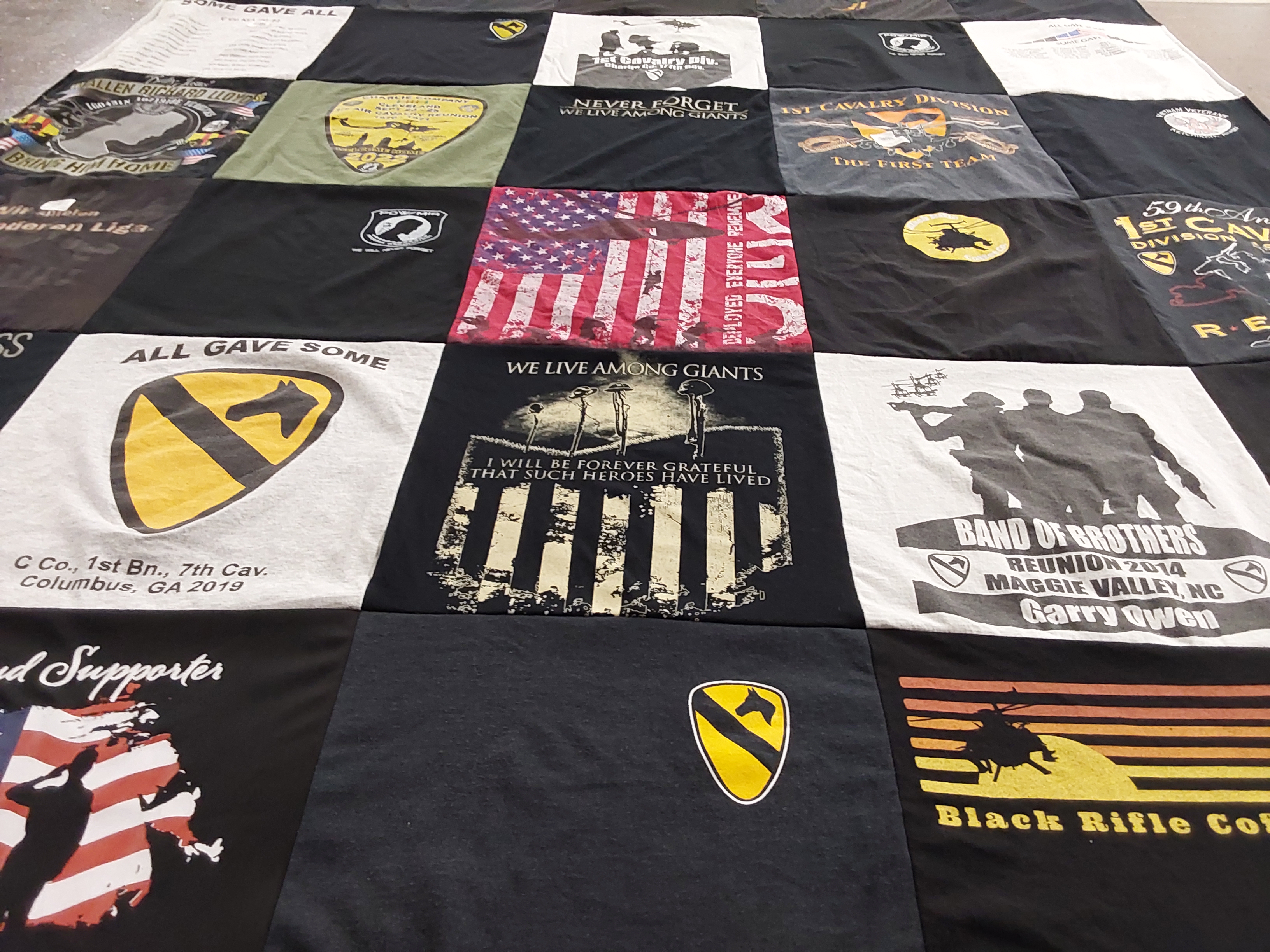 T-shirt quilt with military, veterans themes by M Joseph from IN