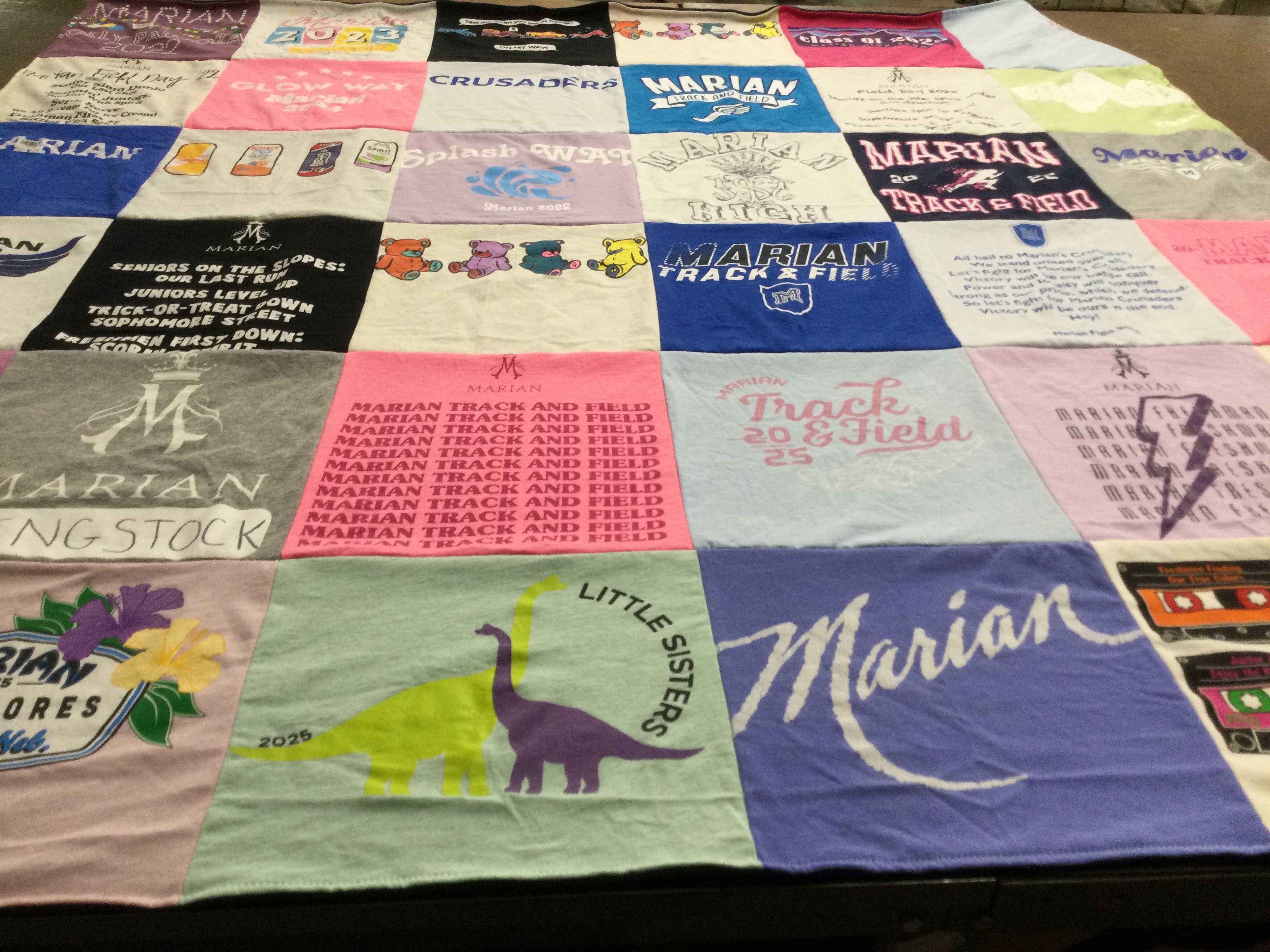 T-shirt quilt featuring marian track and field by Molly from NE