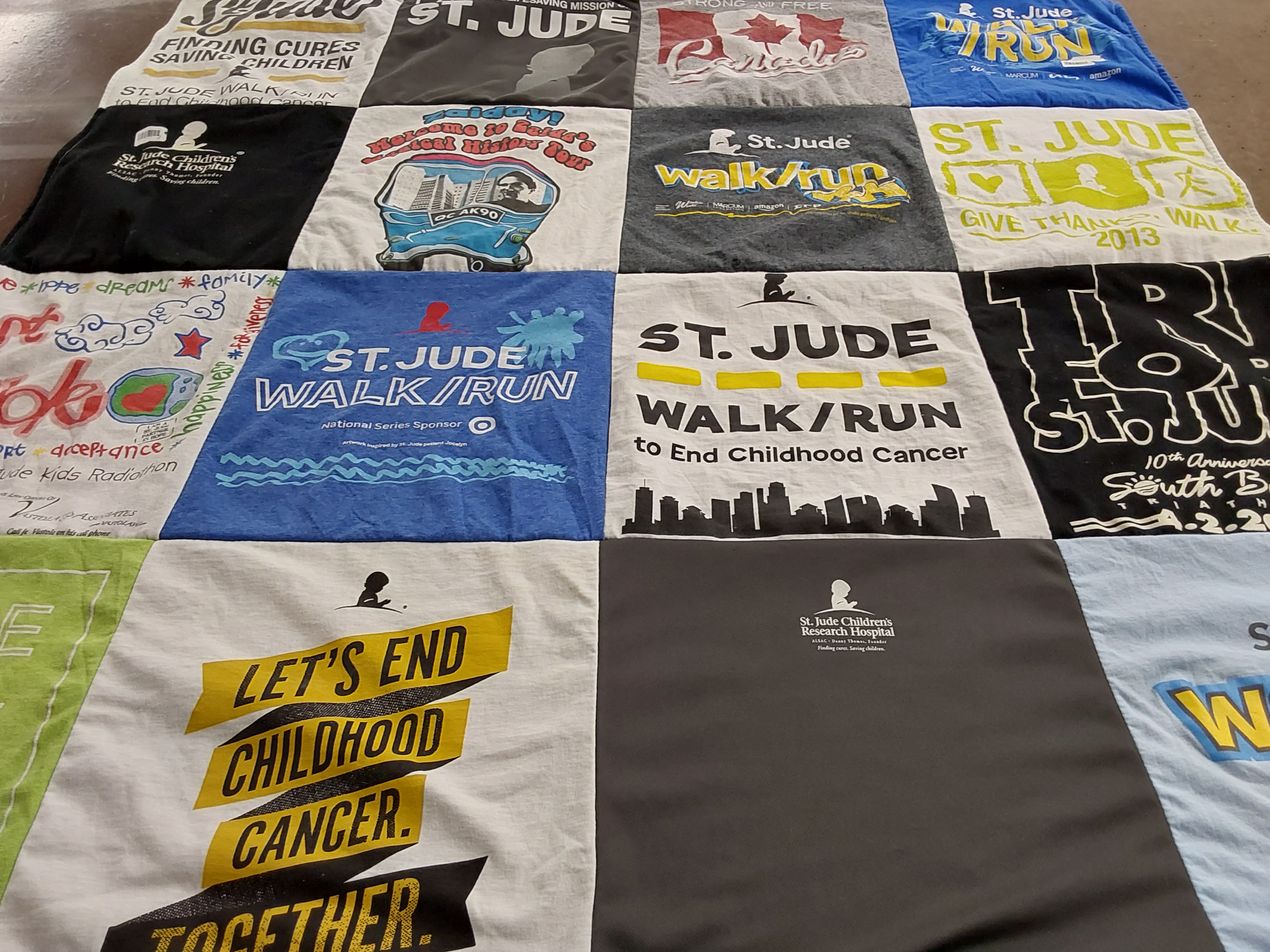 T-shirt quilt with childhood cancer awareness, fundraising themes by Barbara from FL