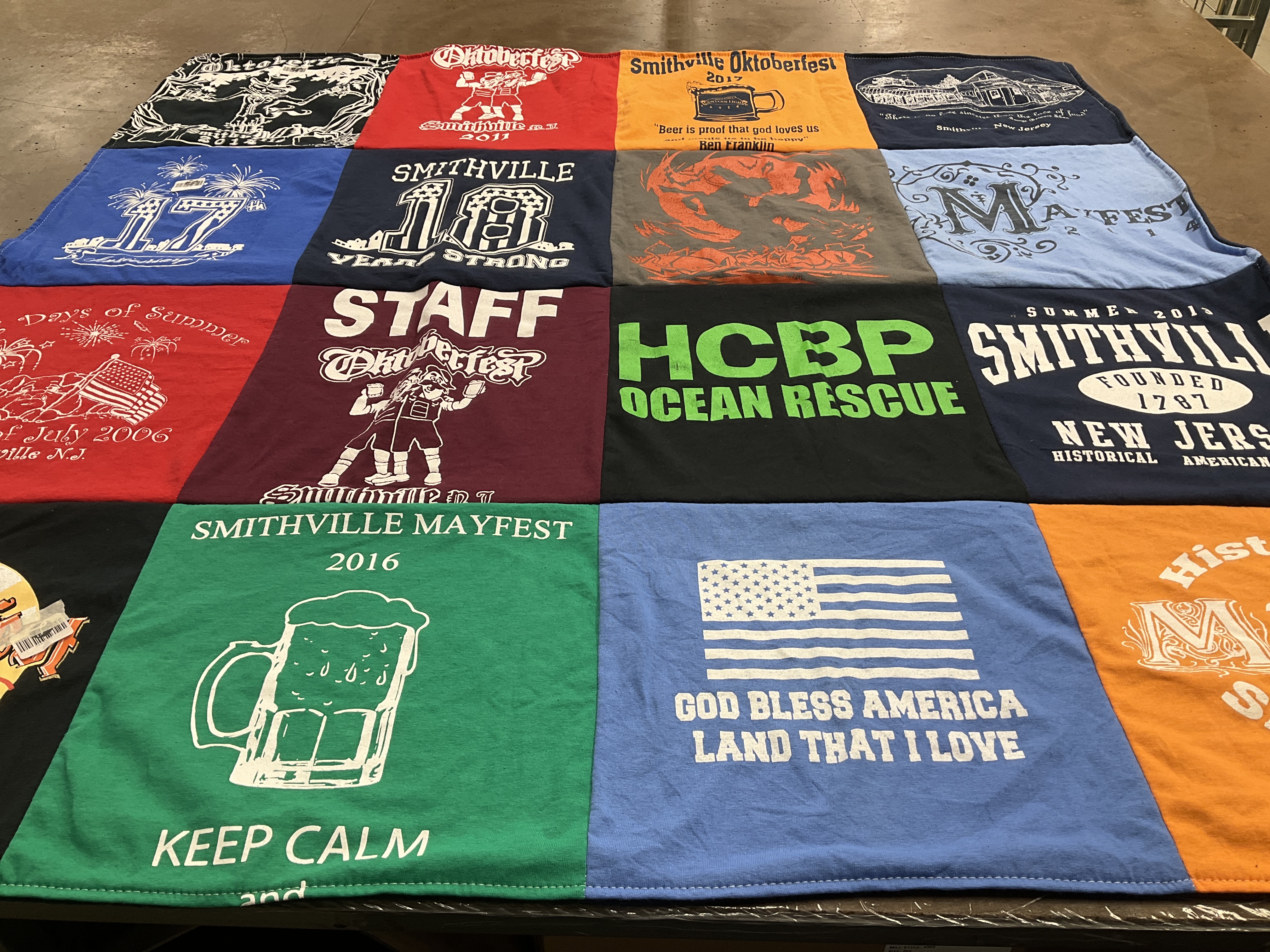 T-shirt quilt with festivals, community events themes by Laura from PA