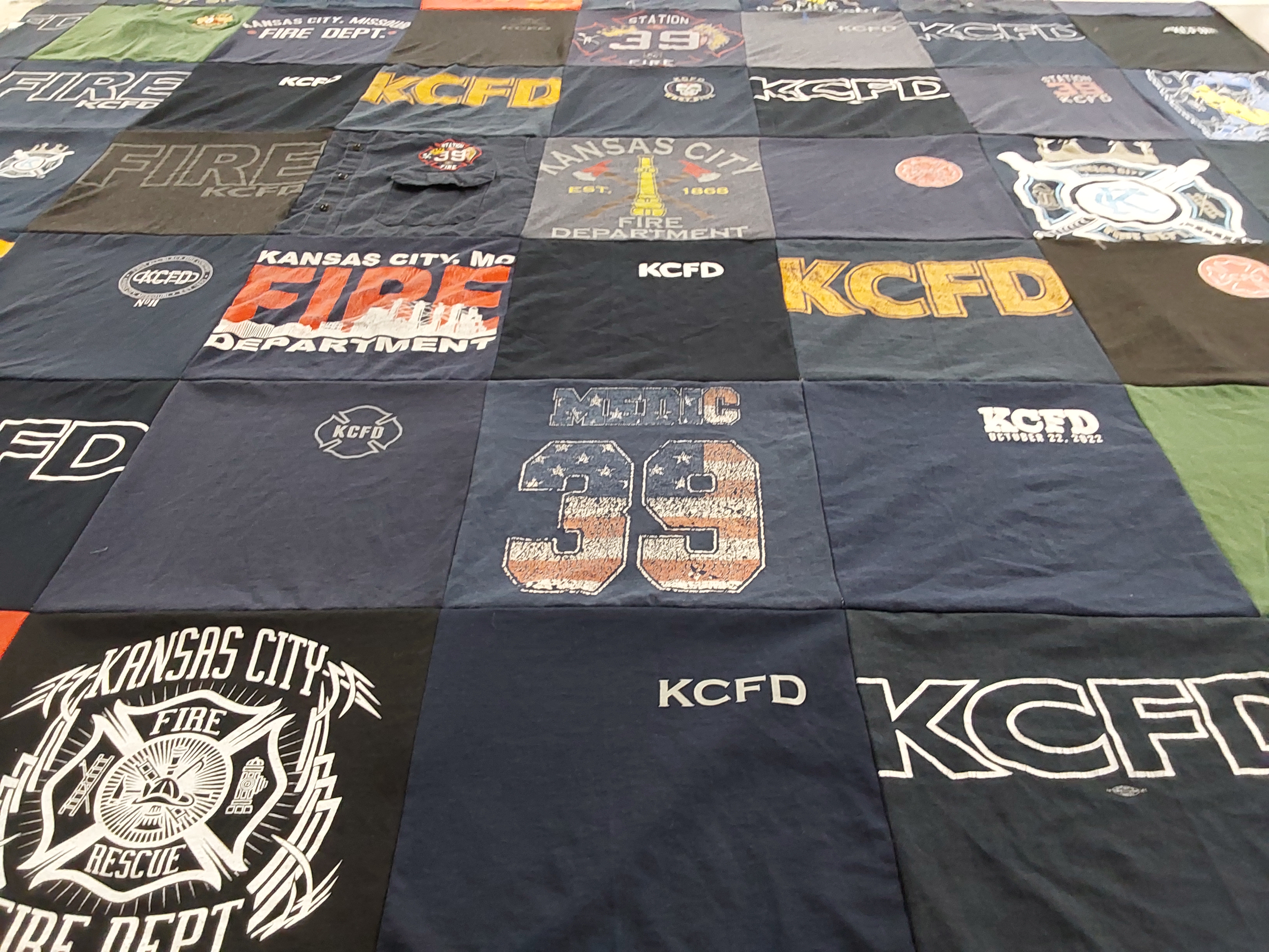 T-shirt quilt with firefighting, emergency services themes by Paige from MO