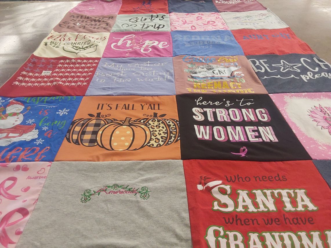 T-shirt quilt with seasonal celebrations, feminism themes by Nancy from NH