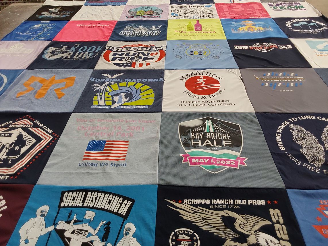 T-shirt quilt with running, travel themes by Jazmine from CA