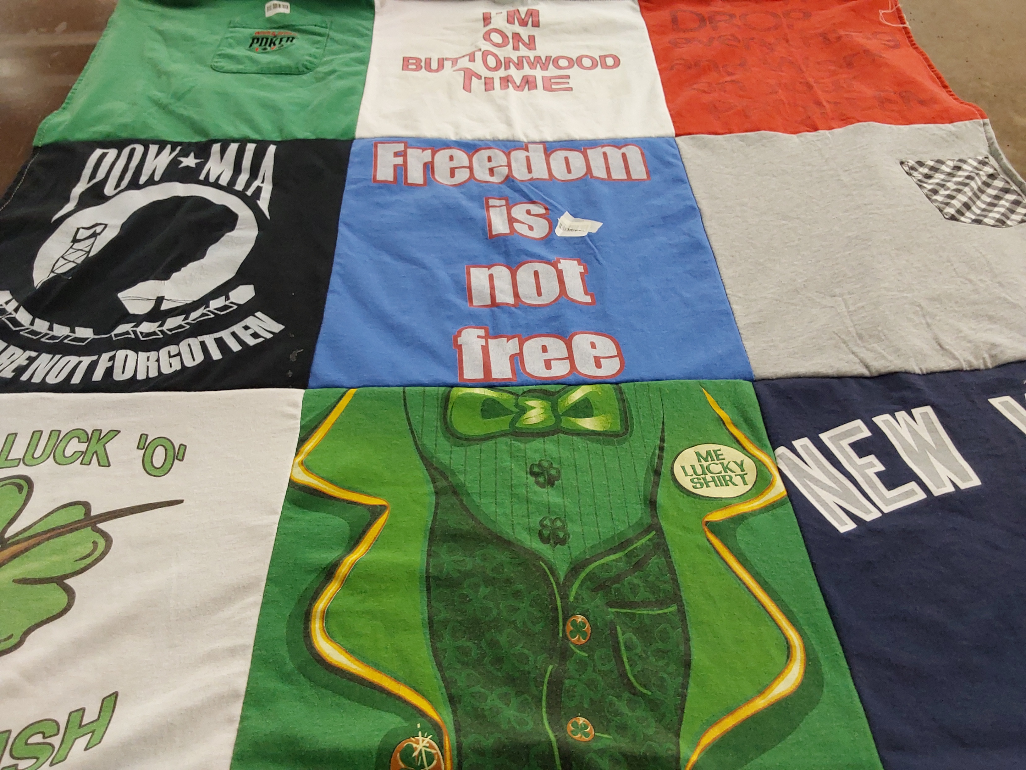 T-shirt quilt with military, st patrick's day themes by Nancy from NY