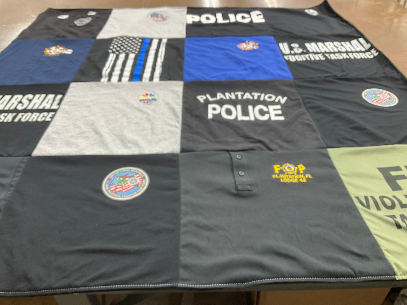 T-shirt quilt with law enforcement, community service themes by Casey from FL